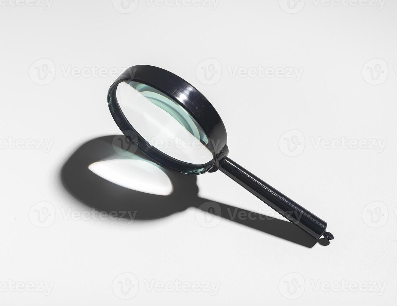 Magnifying glass for business document check. Financial audit and fraud detection concept. Research photo