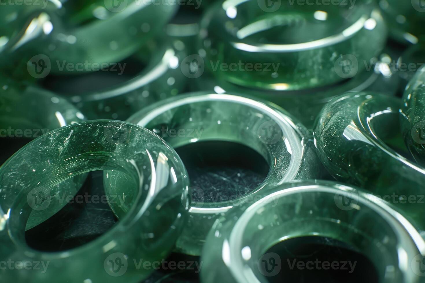 A pile of green jade rings. jade photo