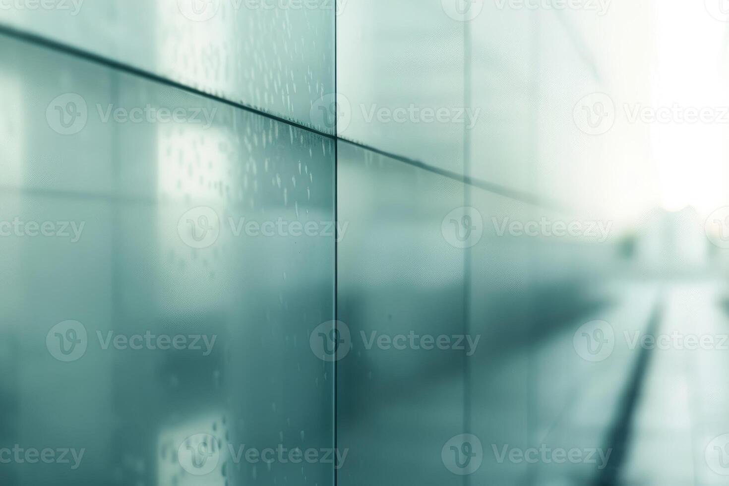 Blurred abstract grey glass wall from building background. photo