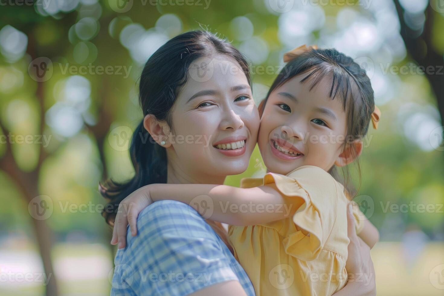 Happy Asian family enjoys summer holidays in park promotes health insurance. photo