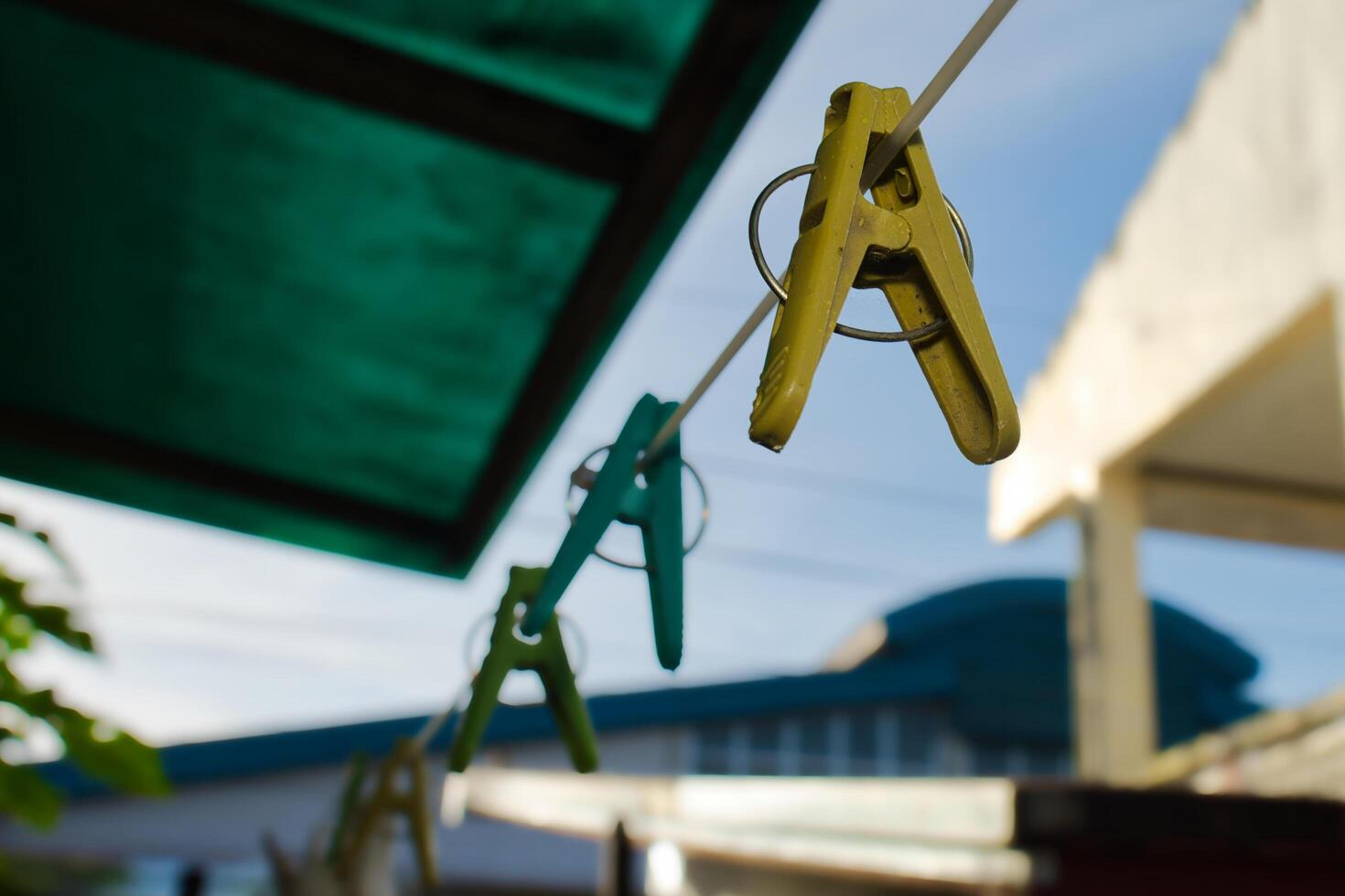 a string of clothes pegs hanging from a clothesline photo