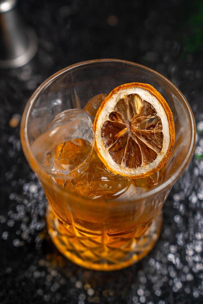 whiskey with dried orange photo
