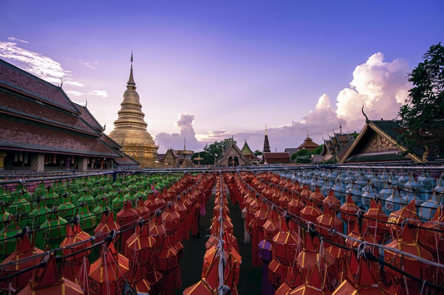 Lanterns made of colorful paper are hung during the annual festival at Wat Phra That Hariphunchai in Lamphun Province. photo