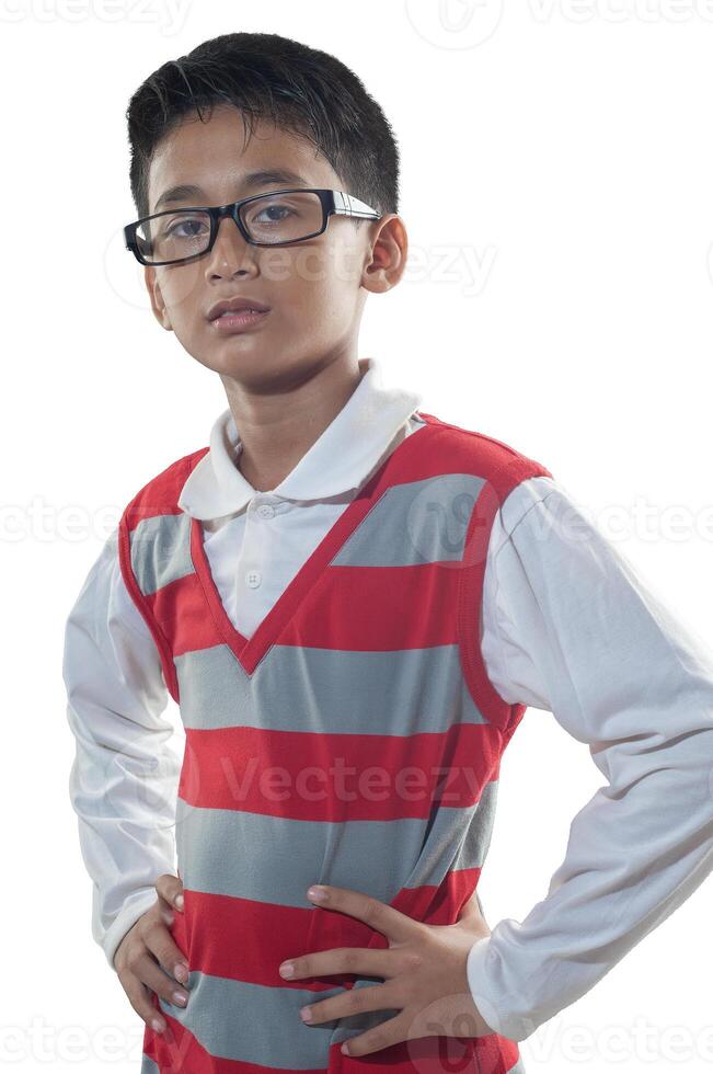 an indonesian 10 years old boy wearing red stripe sweater and glasses with confidence arm pose photo