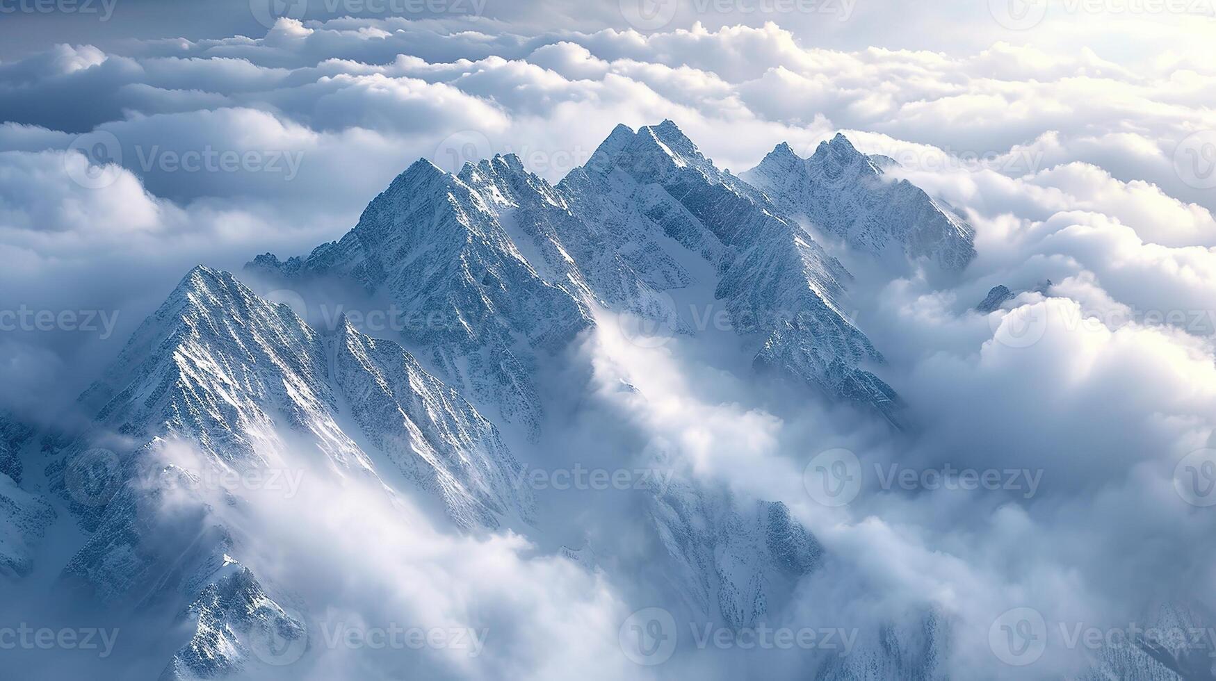 Majestic snowy mountain peak above the clouds photo