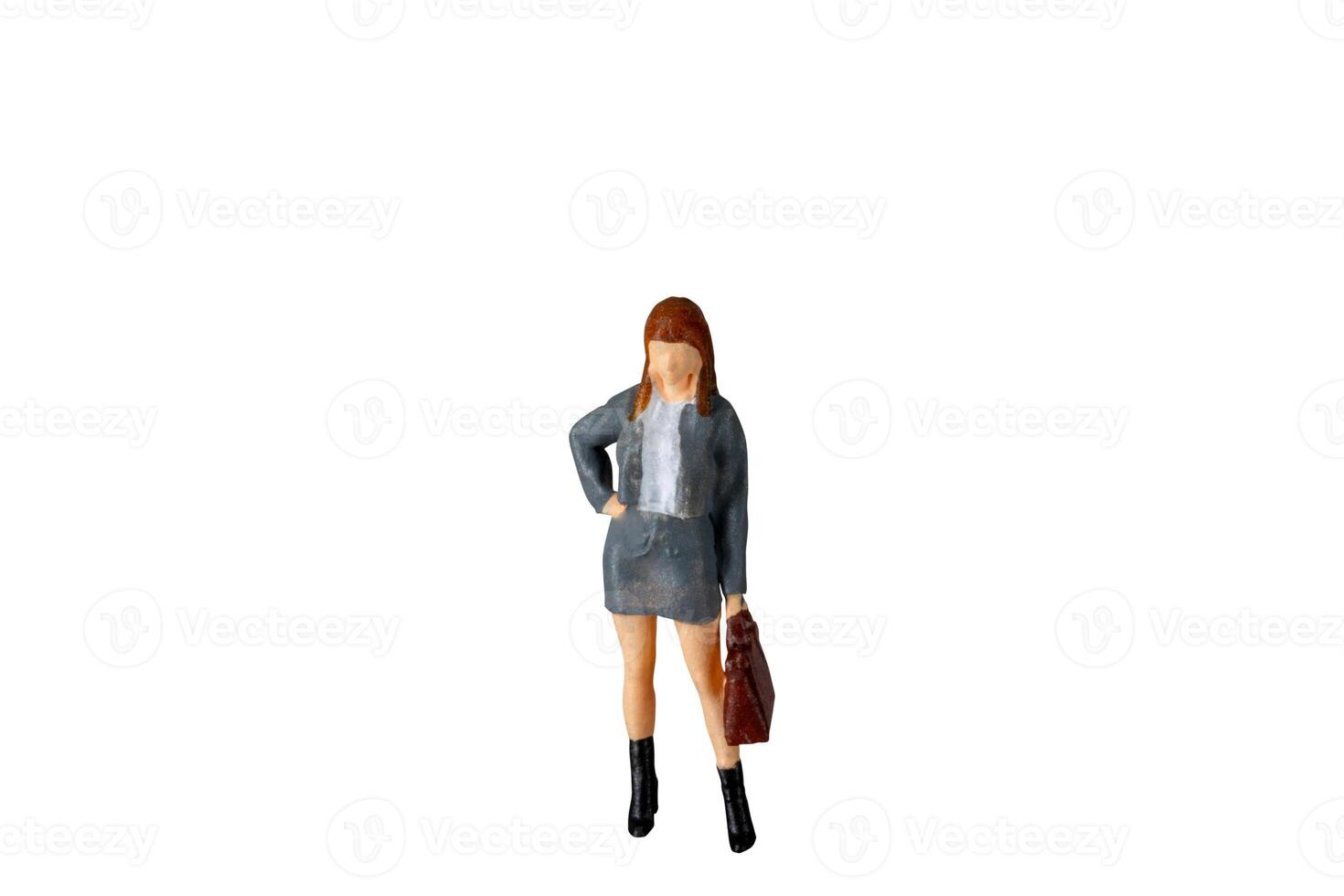 Miniature Business Woman holding suitcase standing isolated on white background with clipping path photo