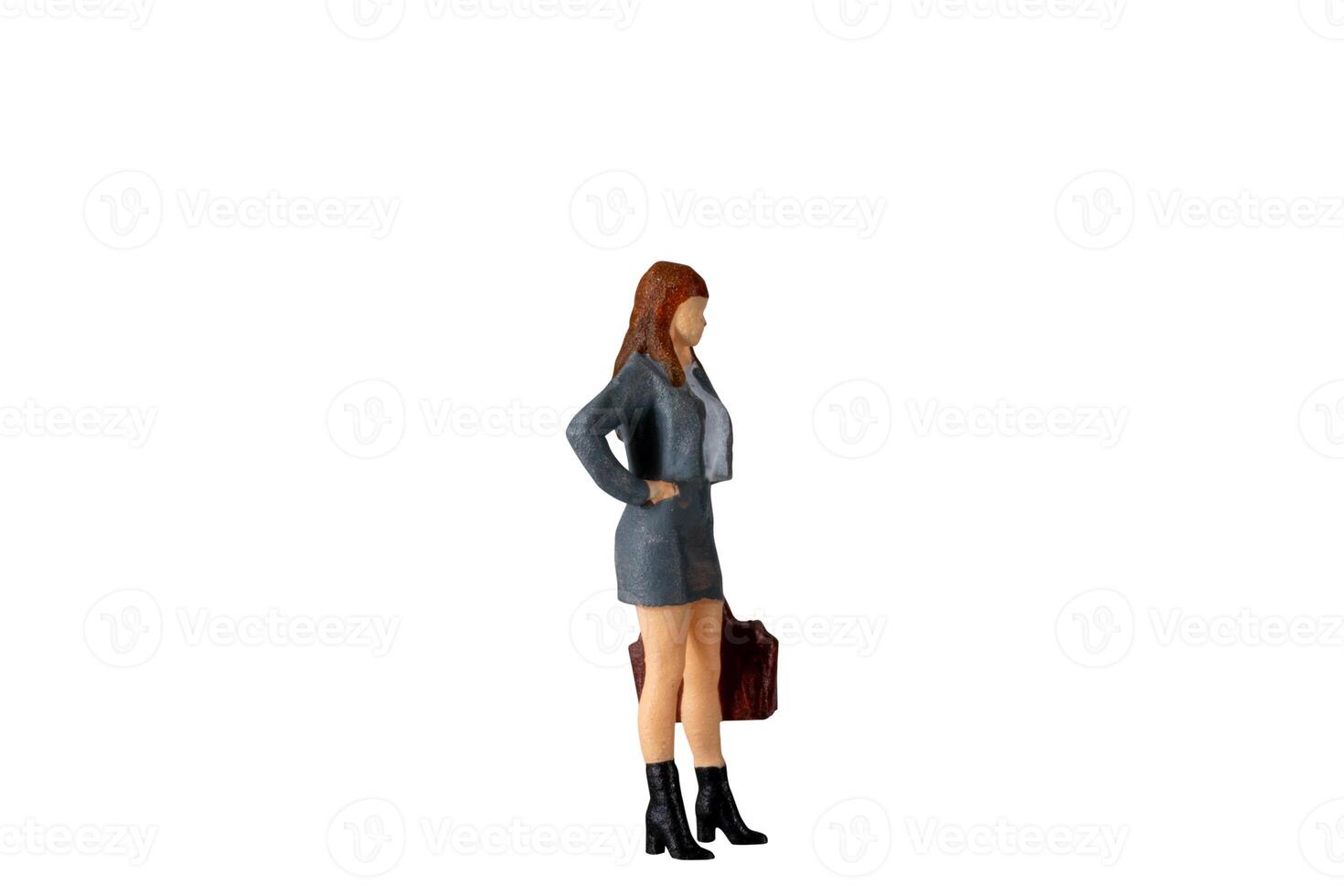 Miniature Business Woman holding suitcase standing isolated on white background with clipping path photo