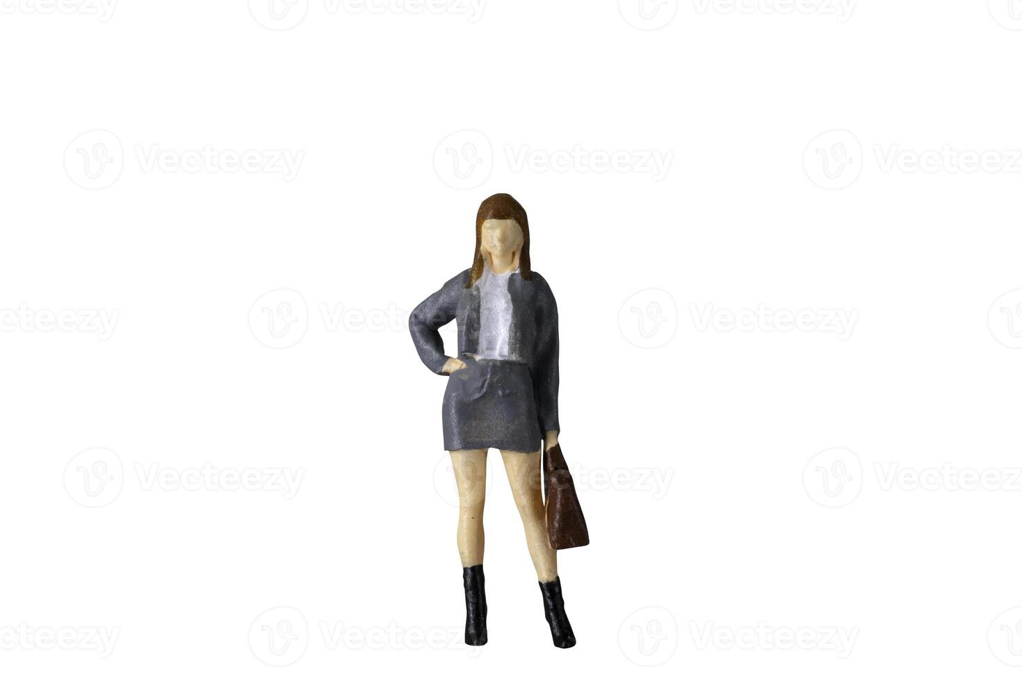 Miniature Business Woman holding suitcase standing isolated on white background with clipping path photo