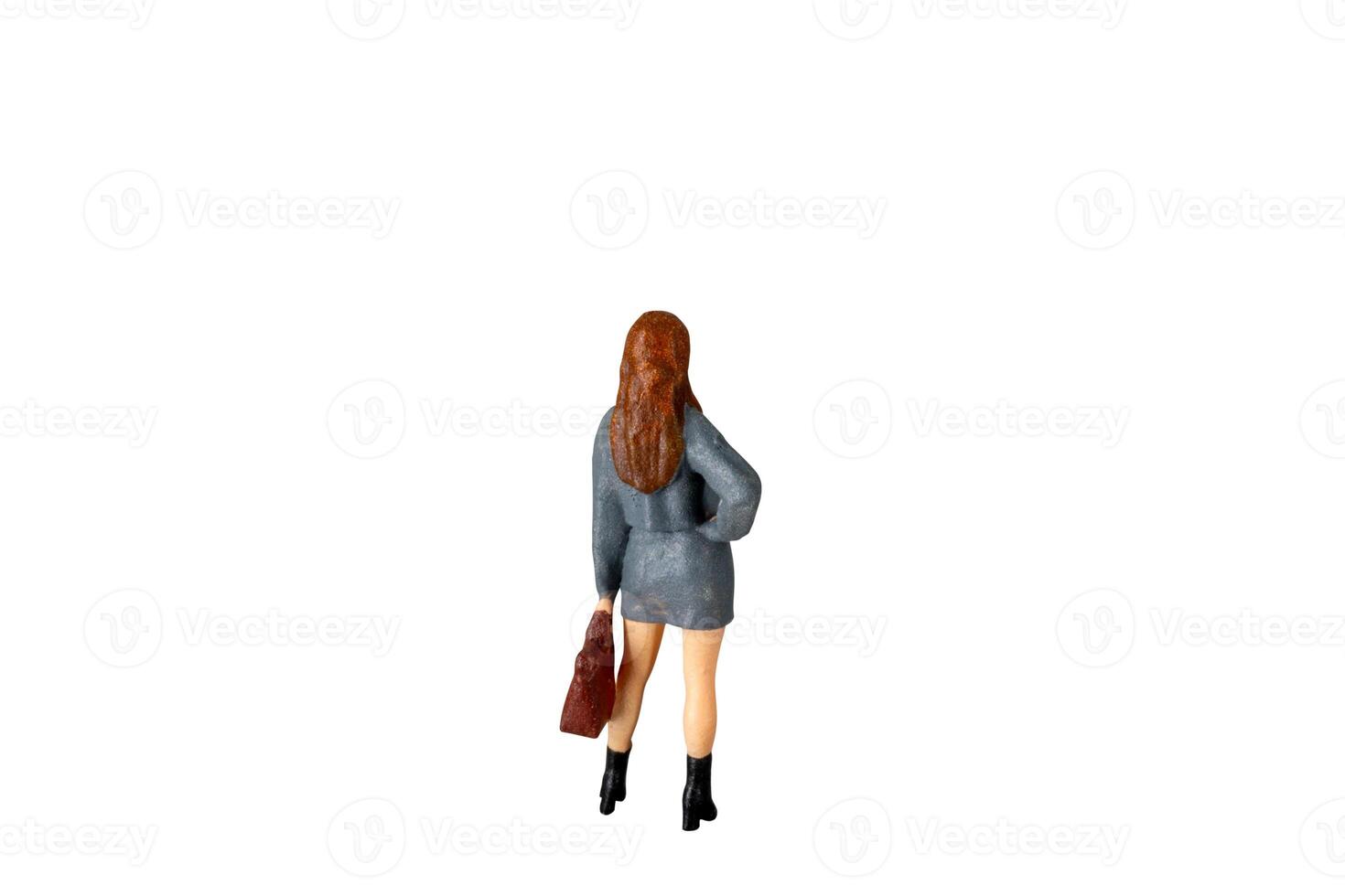 Miniature Business Woman holding suitcase standing isolated on white background with clipping path photo