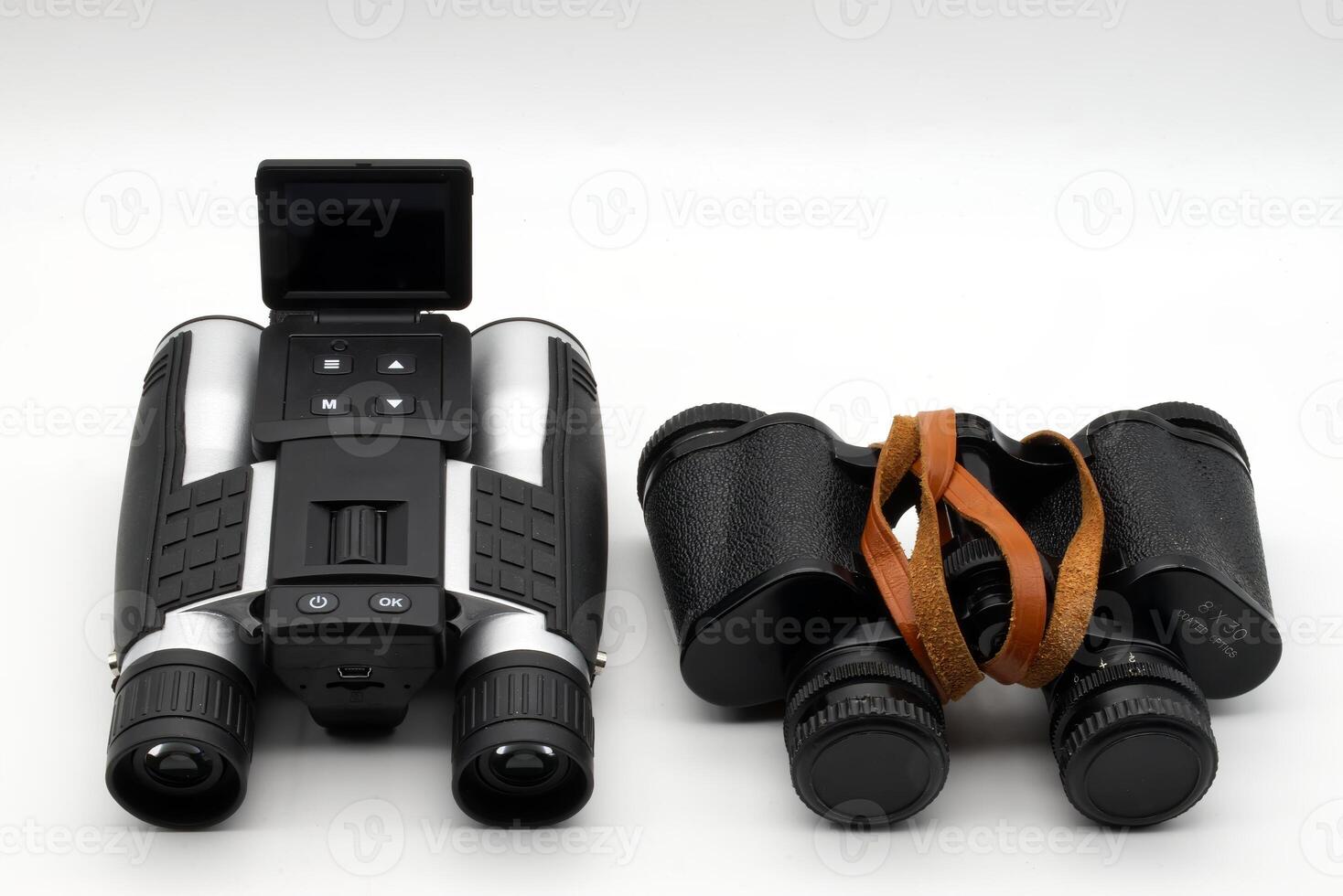 Modern binoculars and vintage binoculars isolated on white background. Vintage binoculars Vs modern binoculars. photo