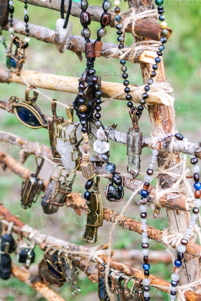Handcraft beads from mineral and stones on a market. Handcraft precious item. Jewelry accessories. photo