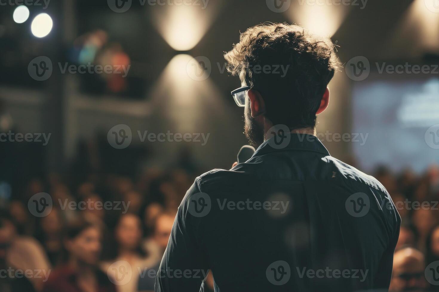 a man is making a presentation to the audience photo