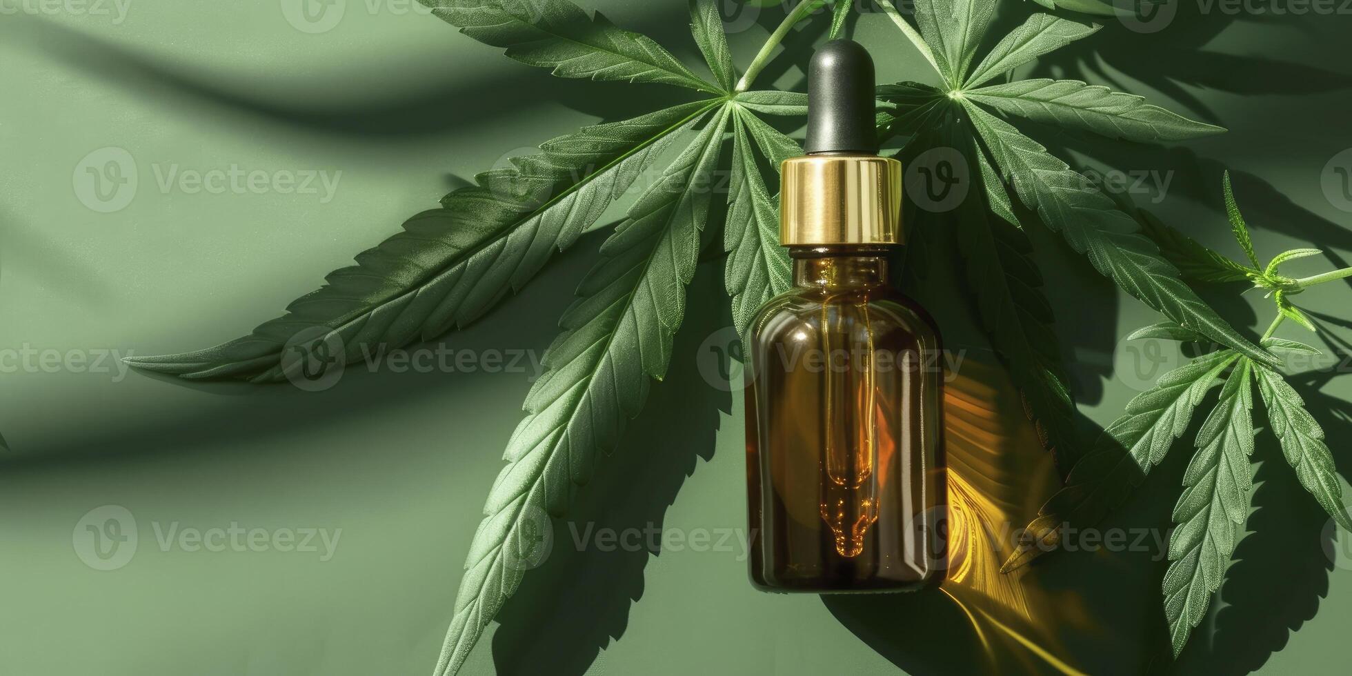 A Glass Bottle with Dropper, Holding a Golden Liquid, Possibly Oil, Positioned Next to a Cannabis Leaf. Against a Green, Shadowy Background. photo