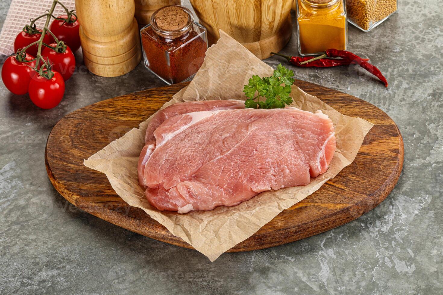 Raw pork schnitzel for cooking photo