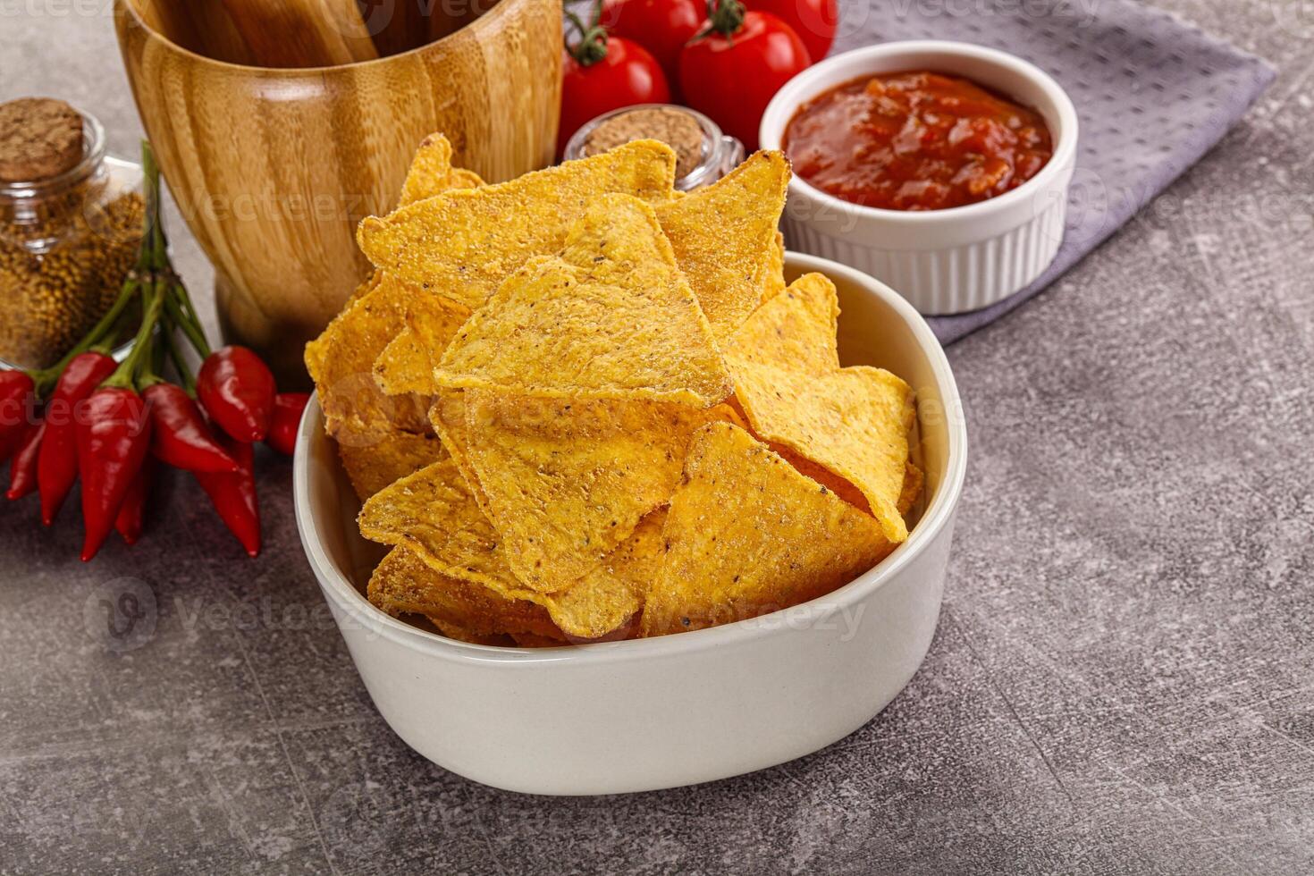 Mexican corn nachos chips with salsa photo