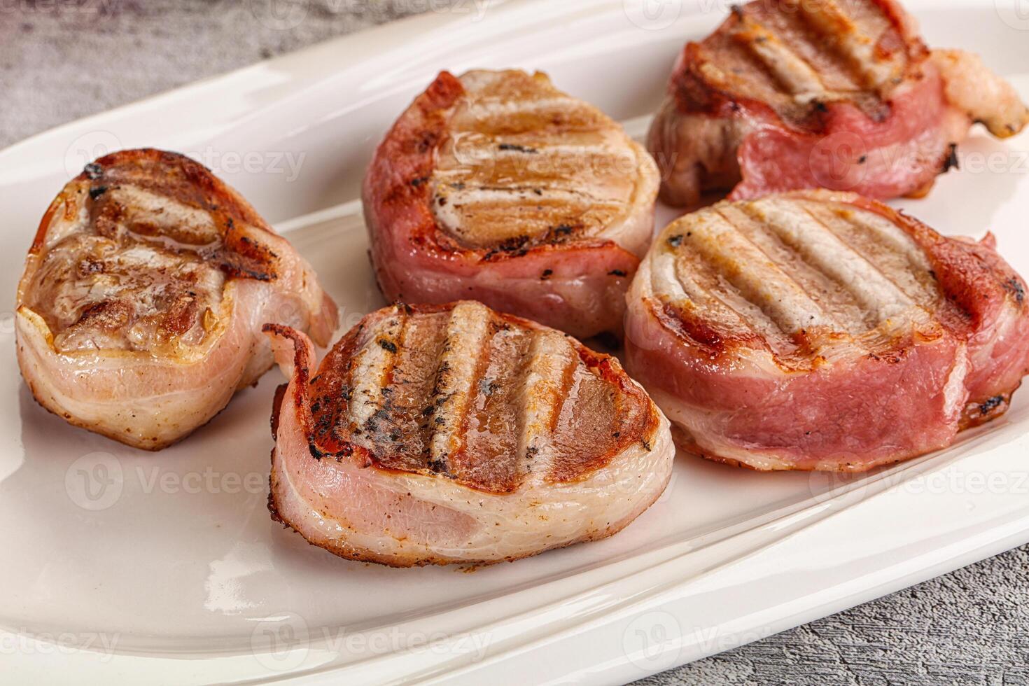 Grilled pork tenderloin with bacon photo