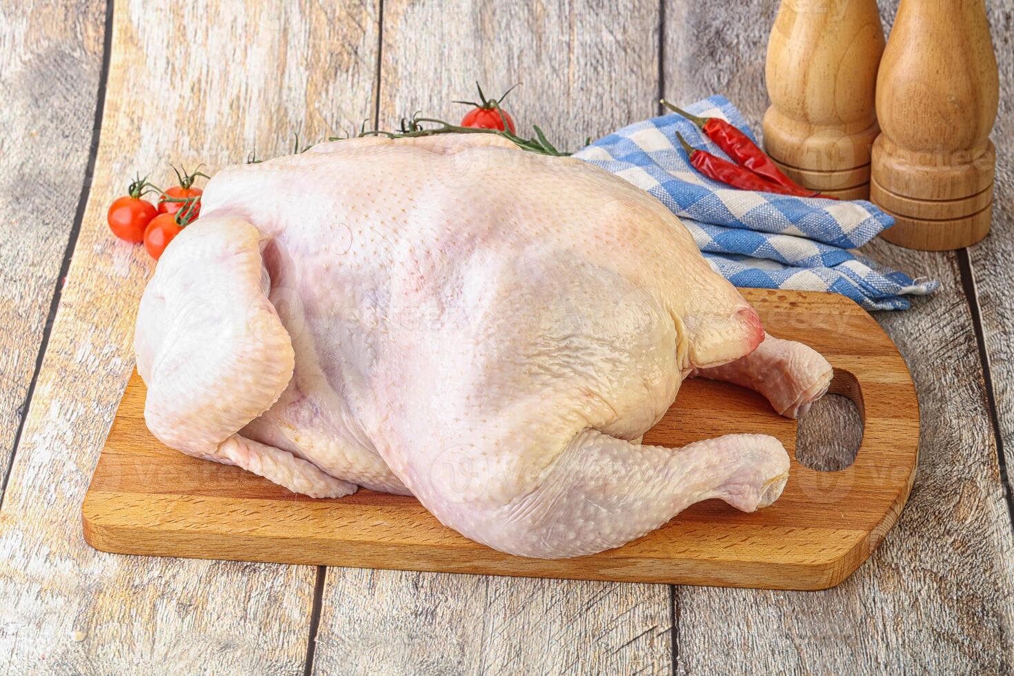 Whole raw chicken for cooking photo