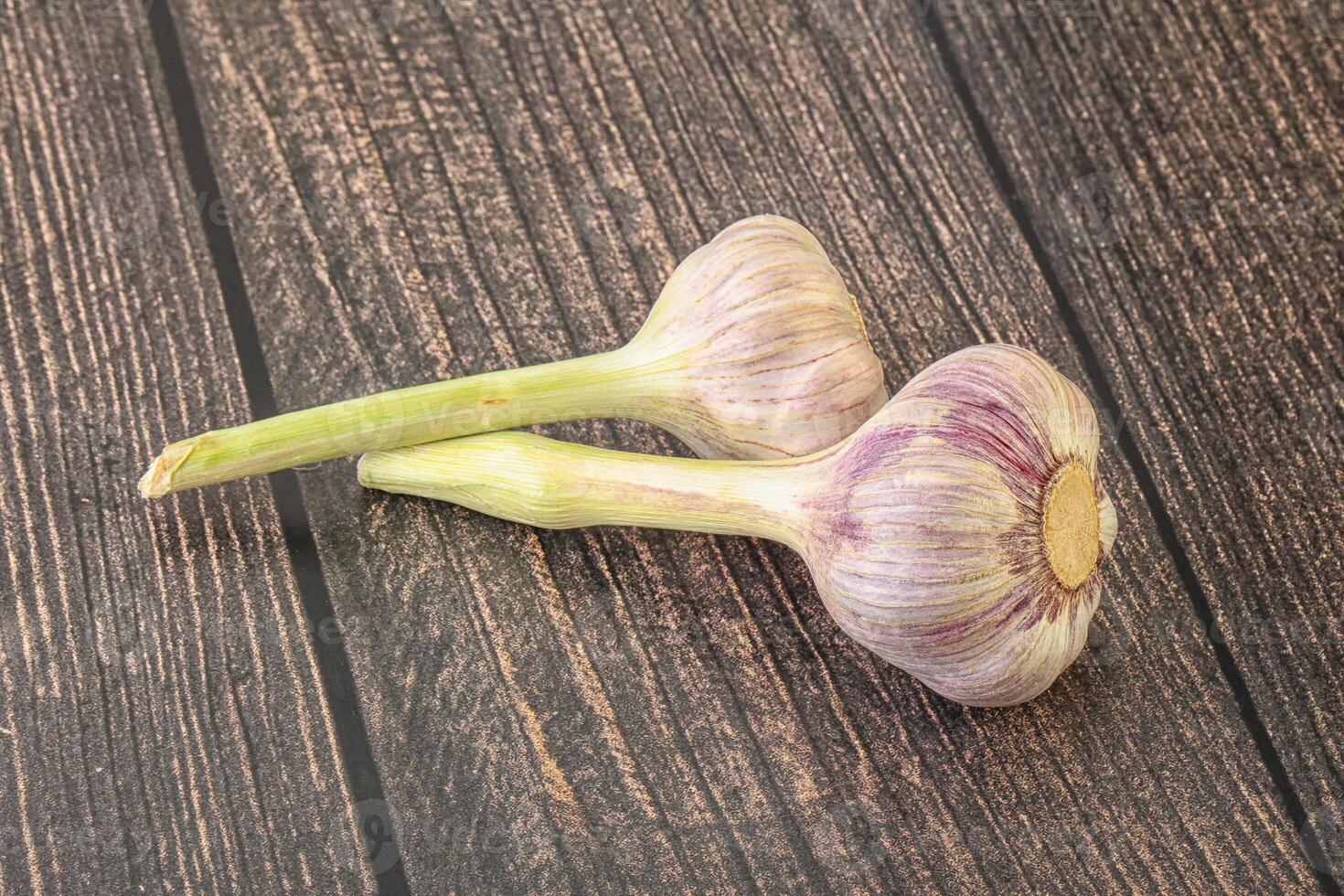 Two Young garlic over background photo