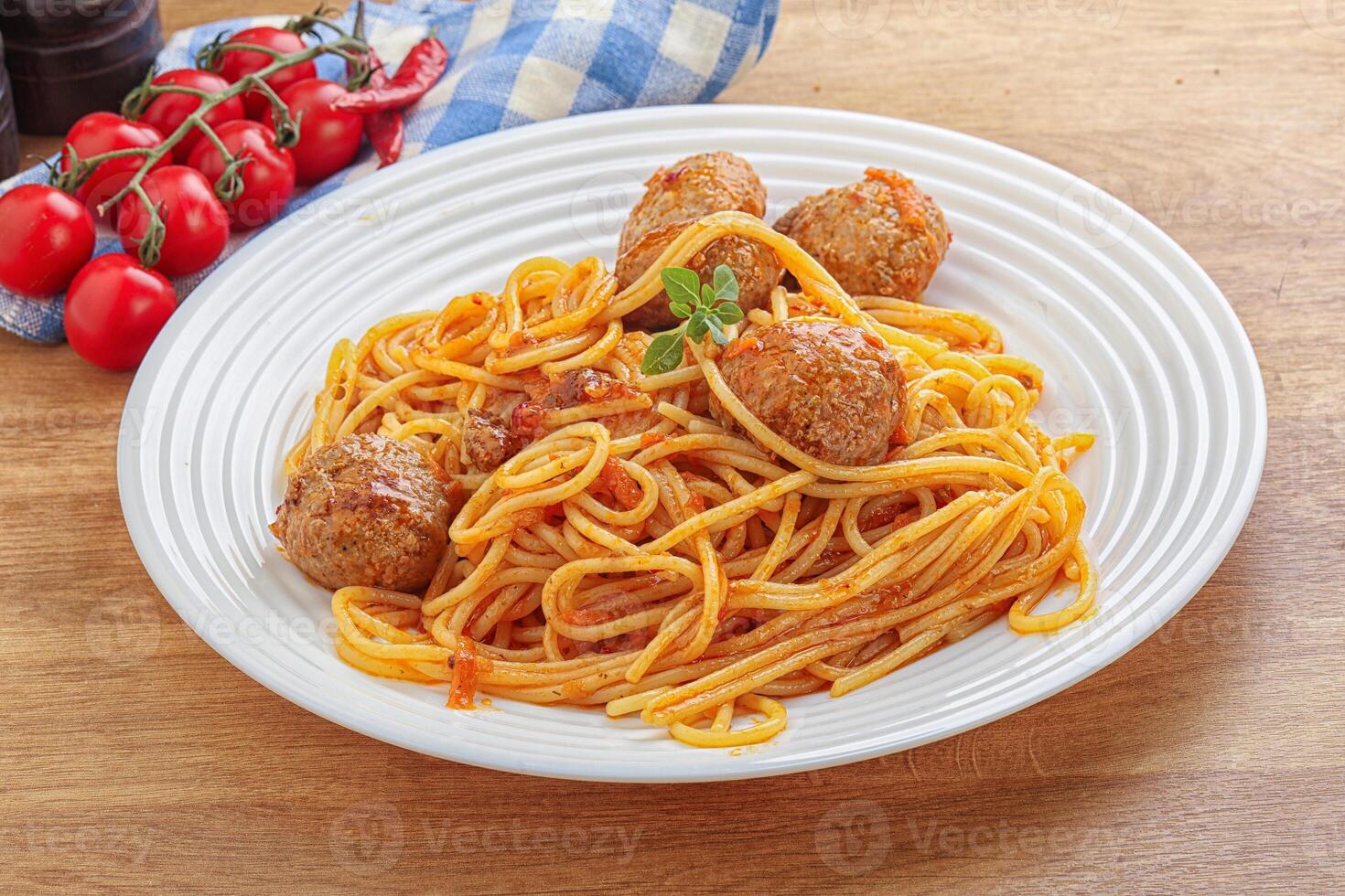 Spaghetti with meatball in tomato sause photo