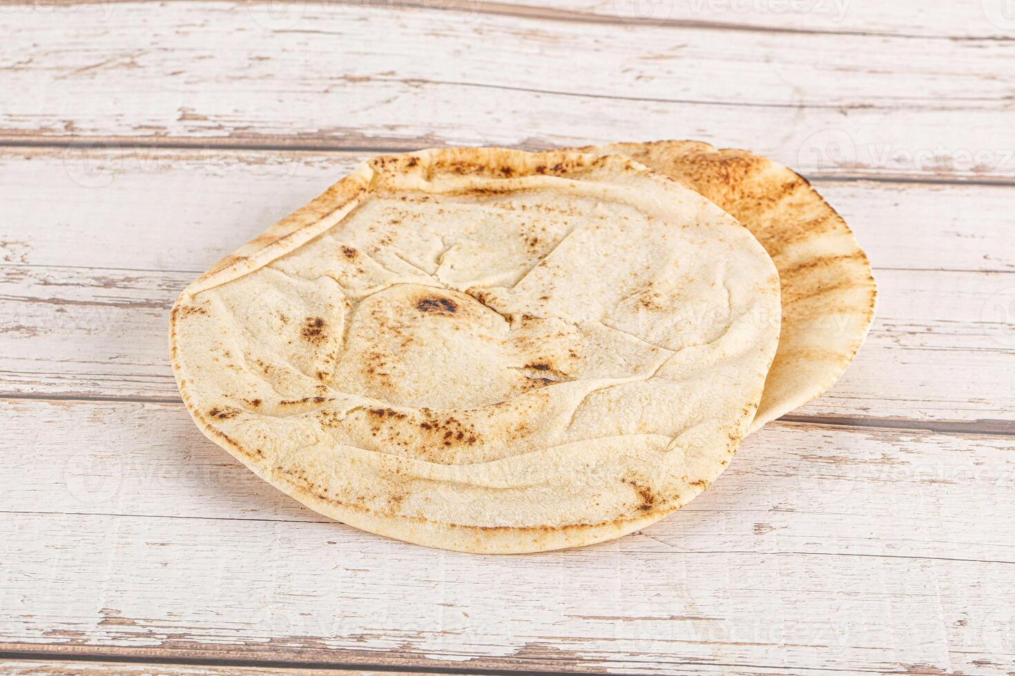 Traditional eastern round pita bread photo