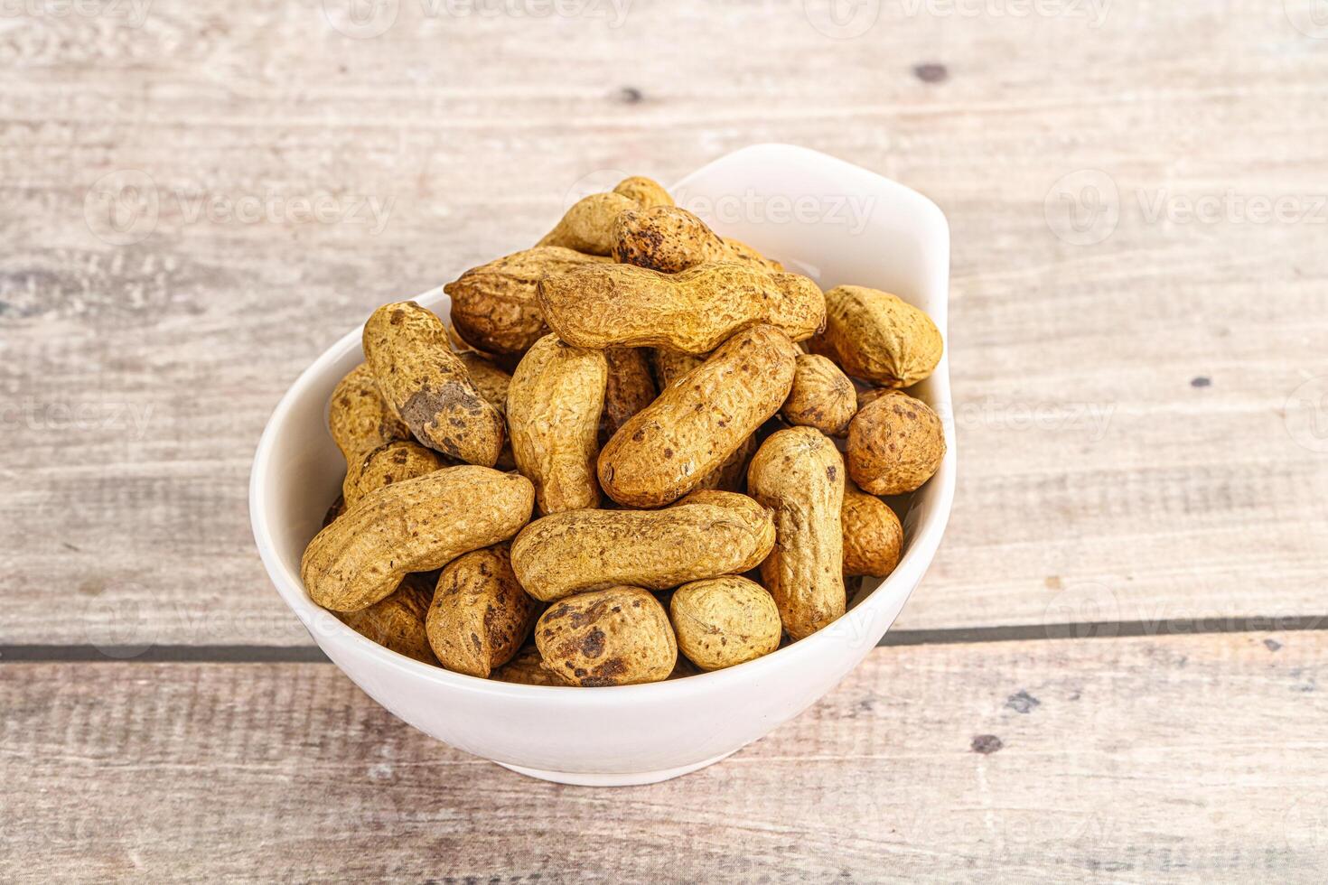 Raw ripe unpeeled peanut heap photo