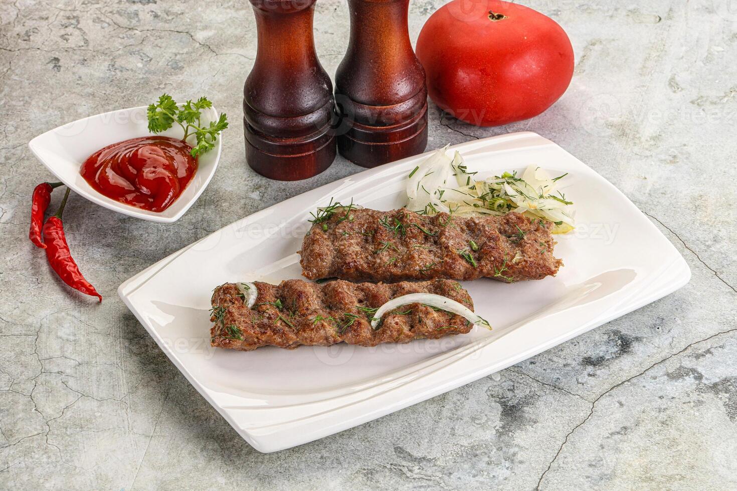 Kebab with beef served onion photo