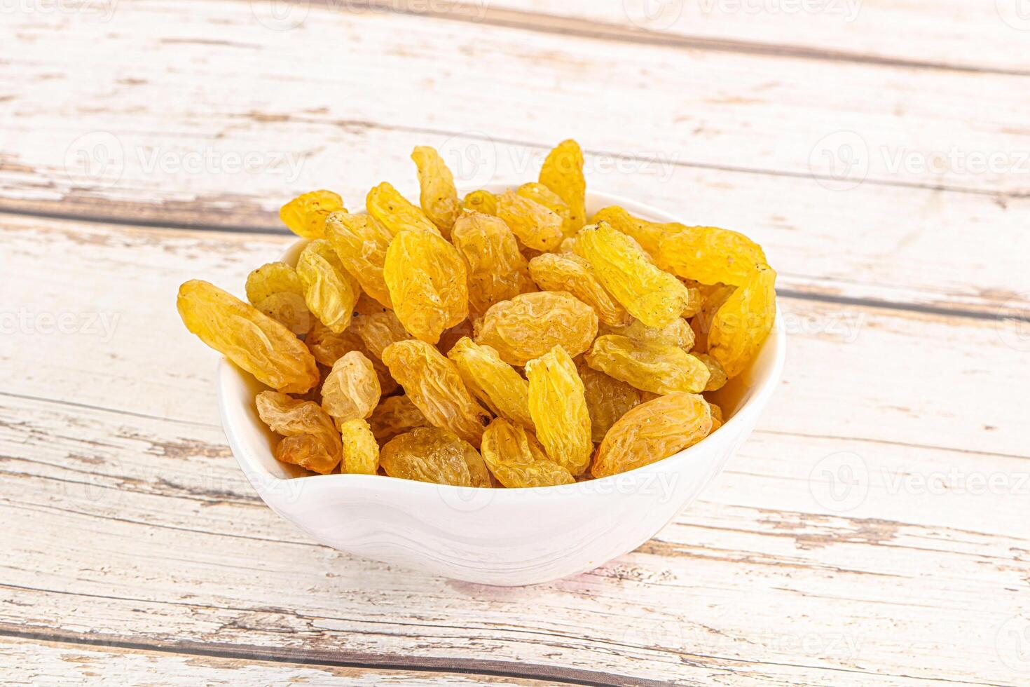 Yellow raisin - dry grape berries photo