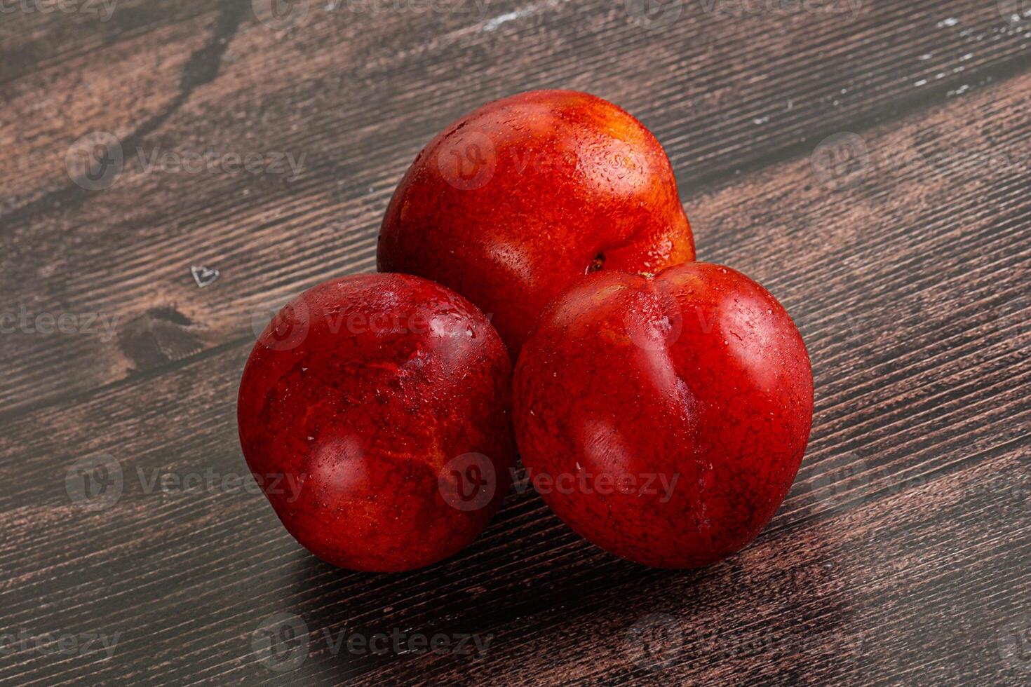Ripe sweet juicy red plum photo