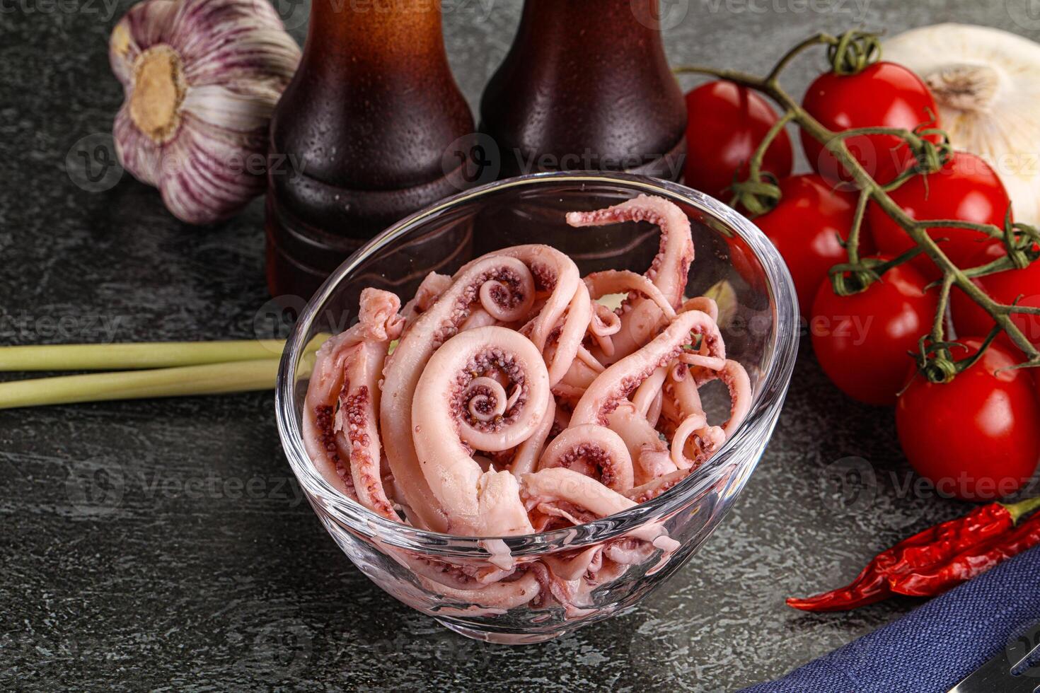 Delicous marinated squid tentacles in the bowl photo