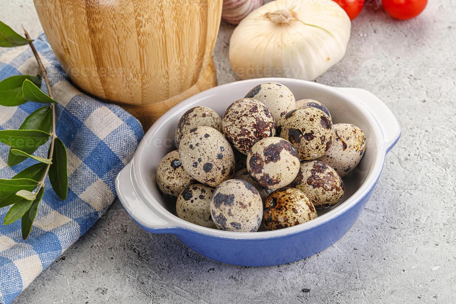 Raw quail eggs in the bowl photo