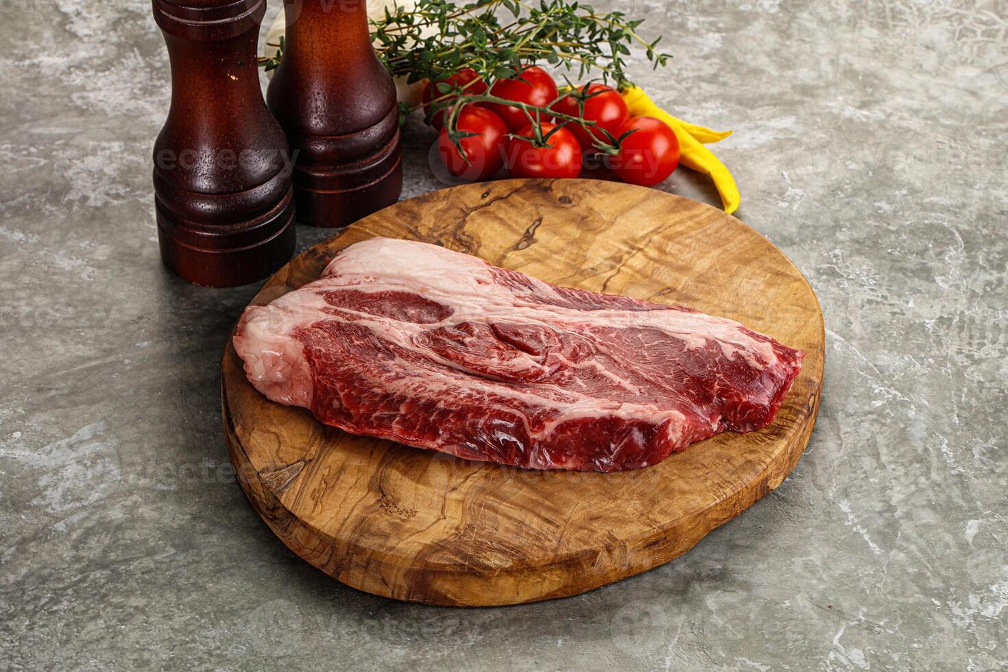Raw beef chuck roll steak photo