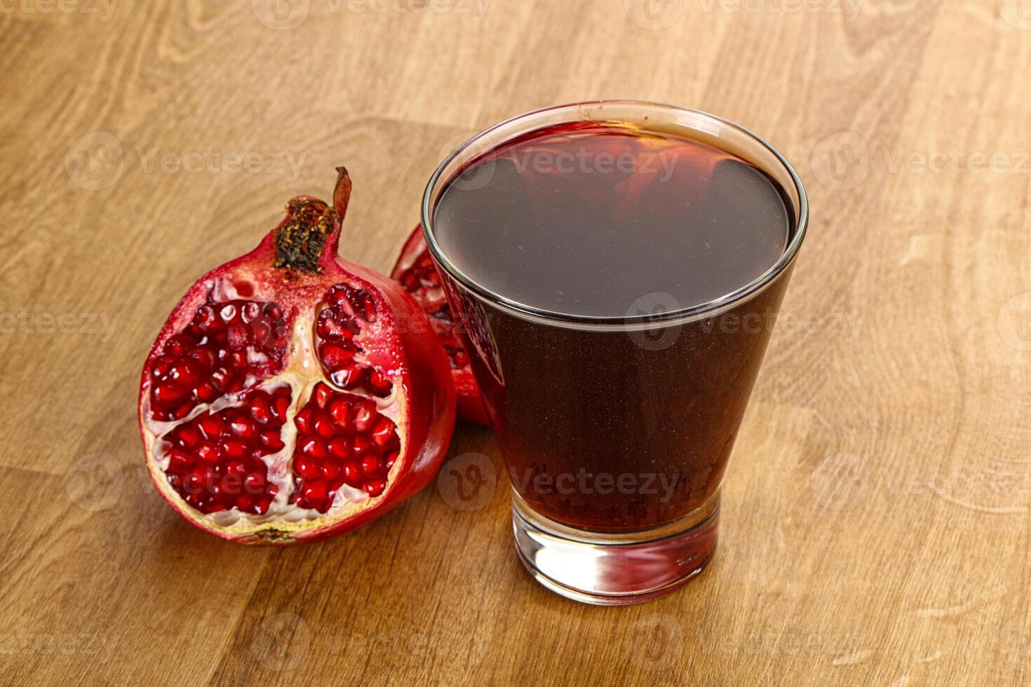 Sweet pomegranate juice in glass photo