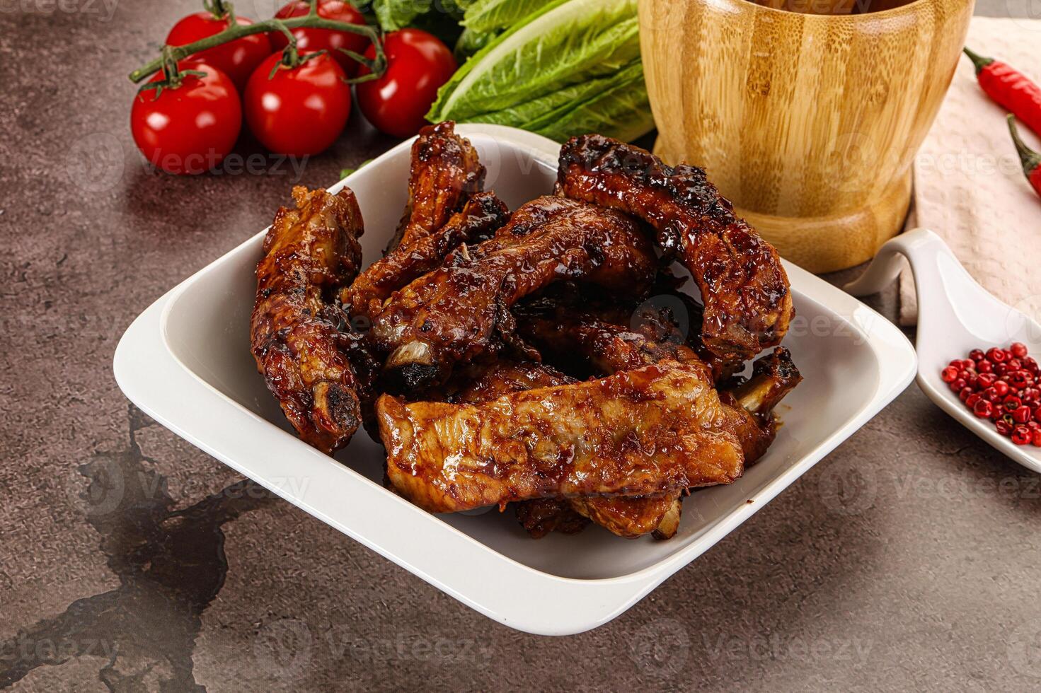 Grilled pork ribs in barbecue sauce photo