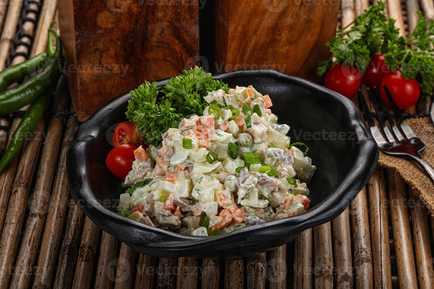 Traditional Russian salad with mayonnaise photo