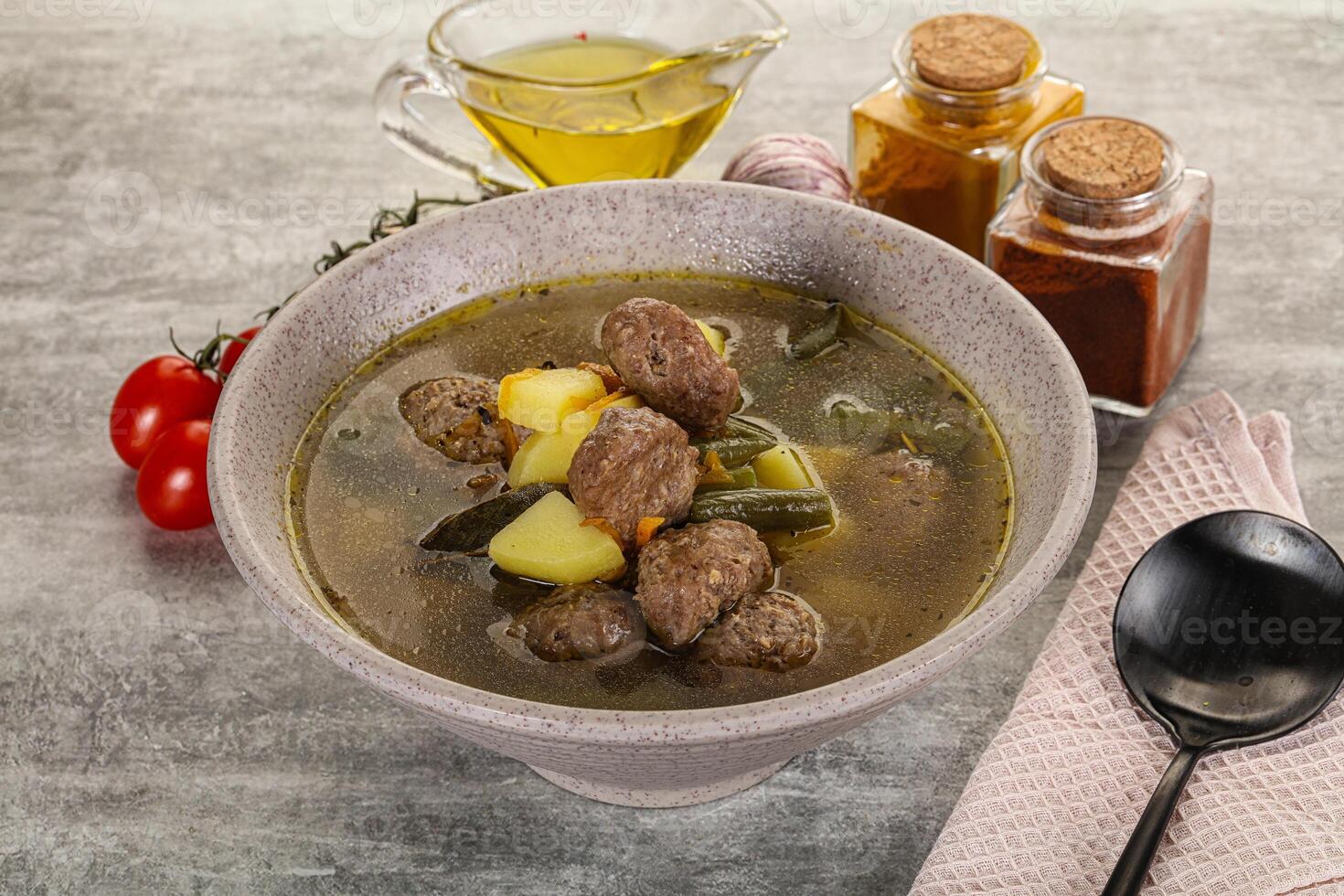 Soup with meatball and potato photo