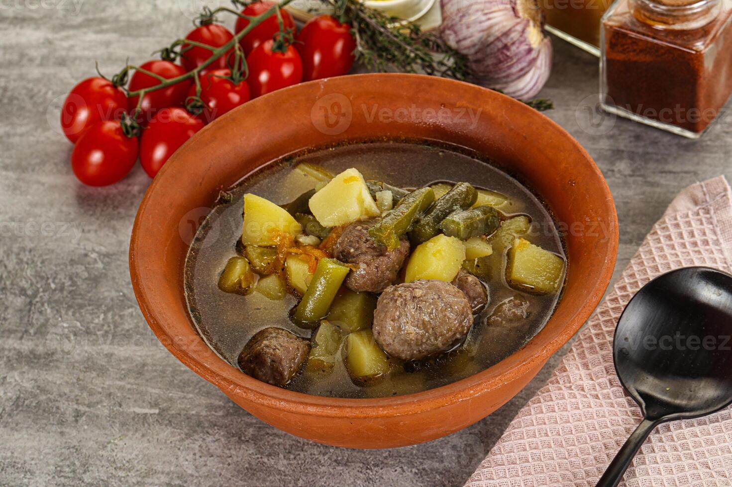 Soup with meatball and potato photo