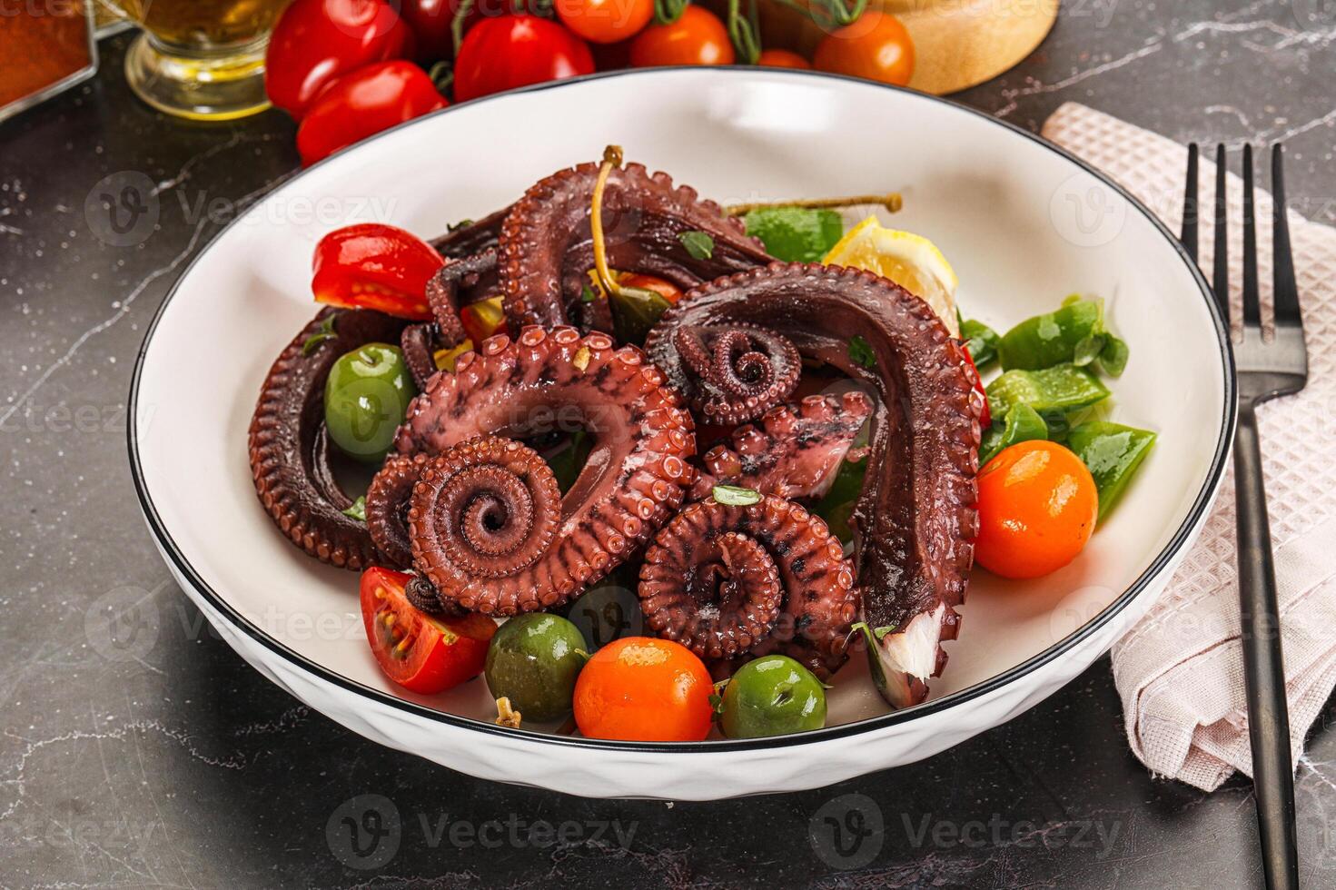 Salad with octopus tentacle and vegetables photo