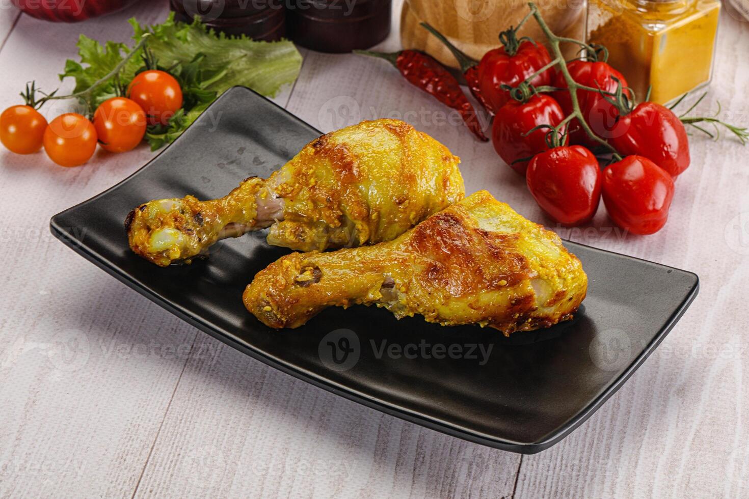 Roasted Chicken leg drumsticks with curry sauce photo