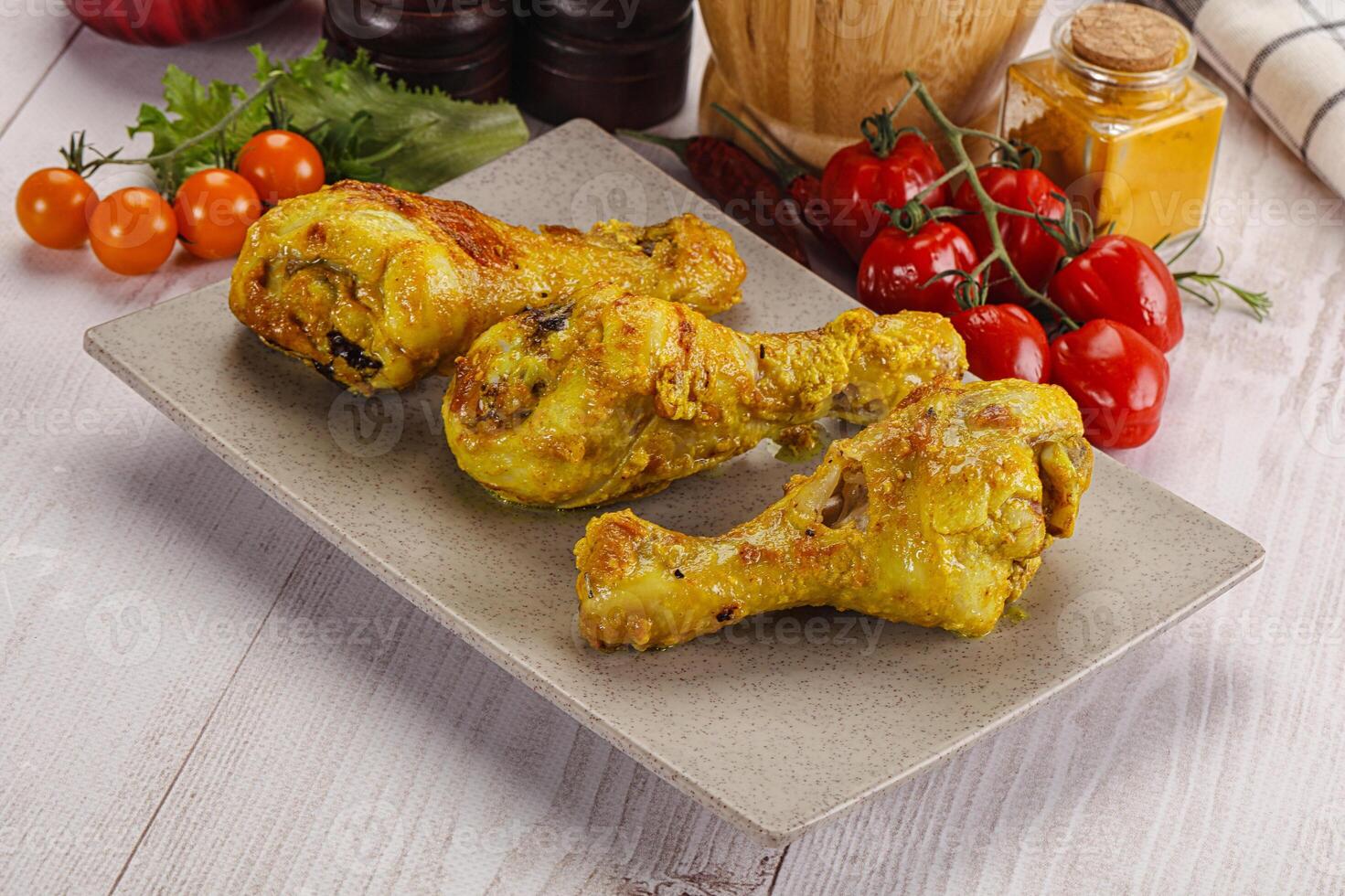 Roasted Chicken leg drumsticks with curry sauce photo