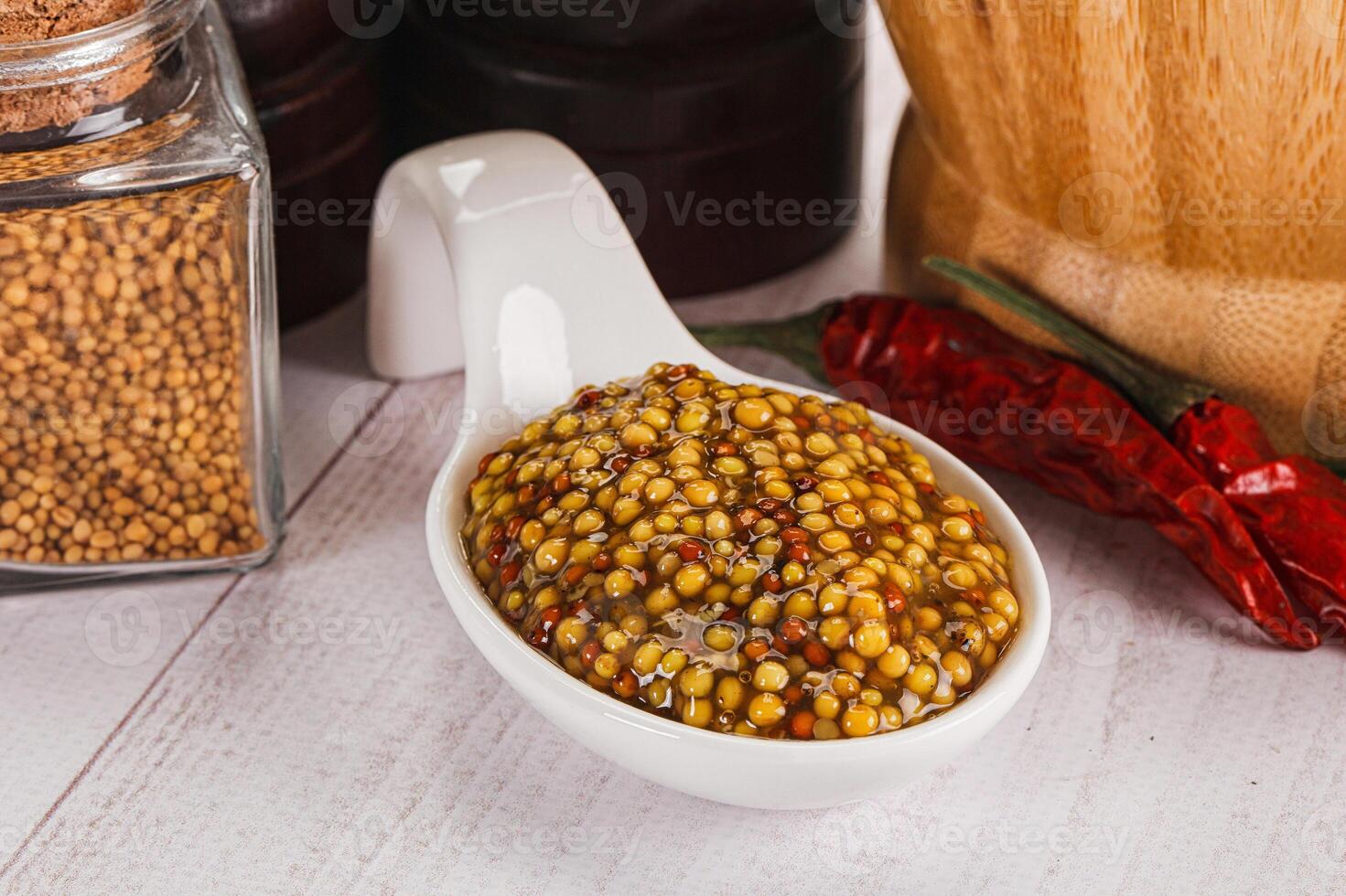 Spicy mustard sauce with seeds photo