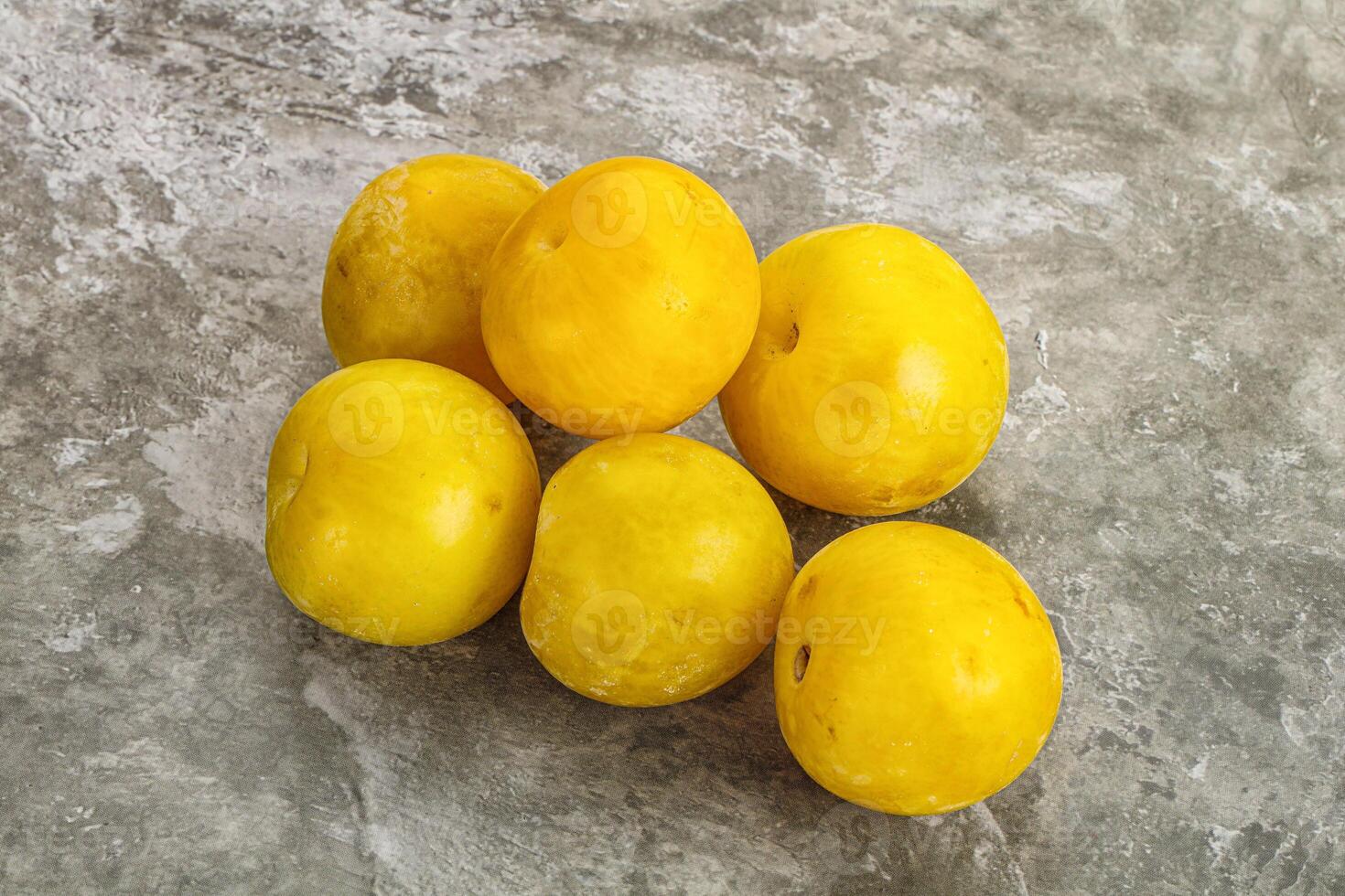 Yellow sweet plum heap fruit photo