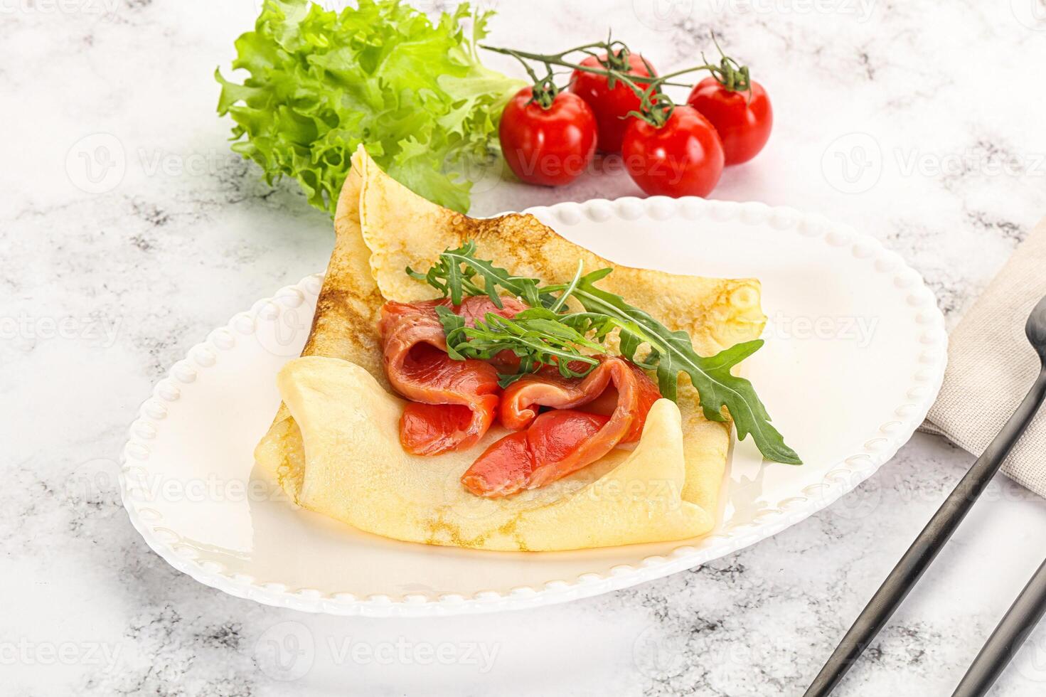 Russian pancake with salmon fish photo