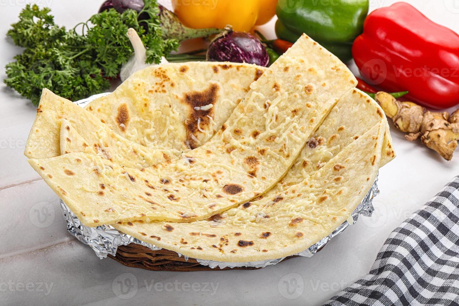 Indian bread cheese garlic naan photo