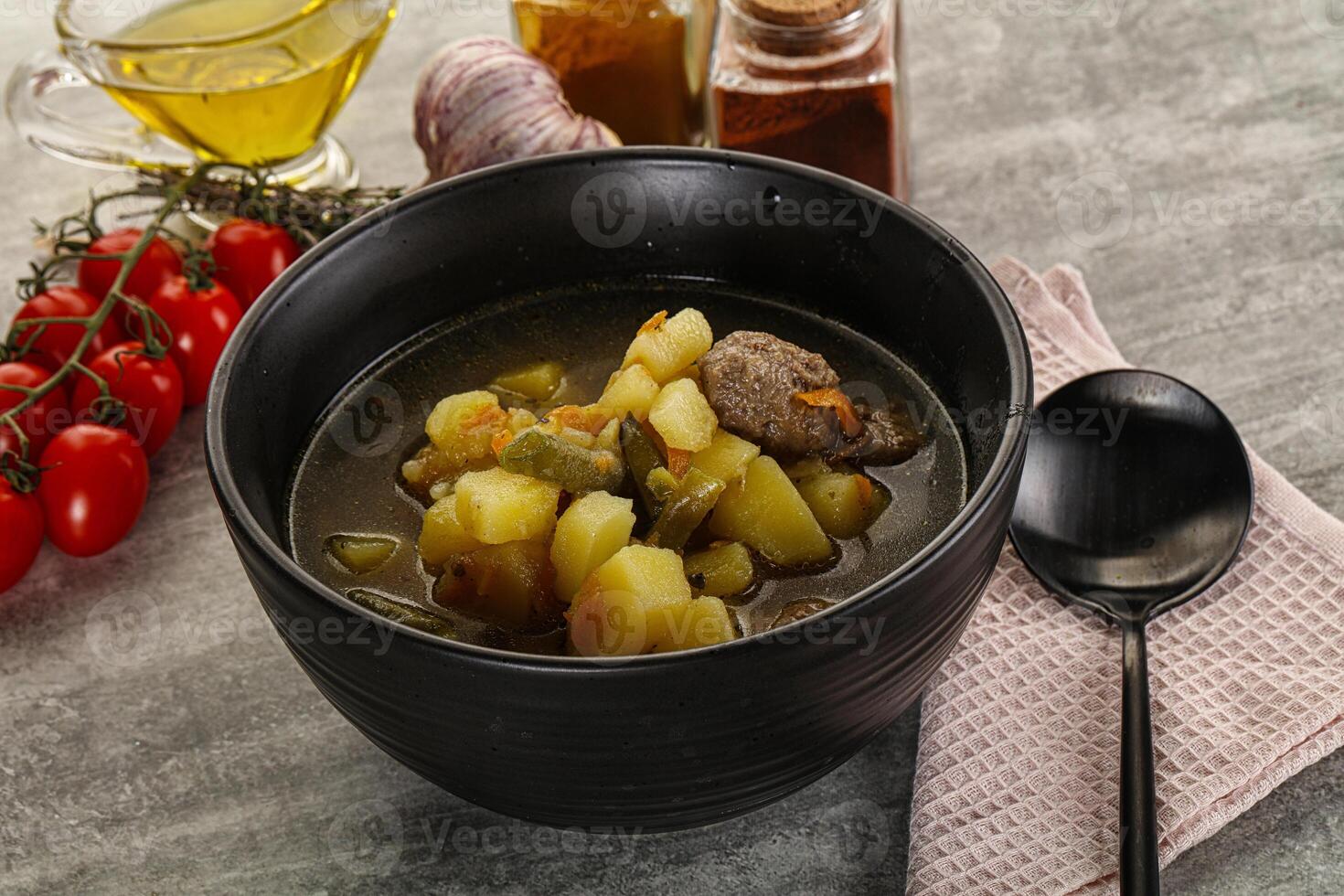 Soup with meatball and potato photo