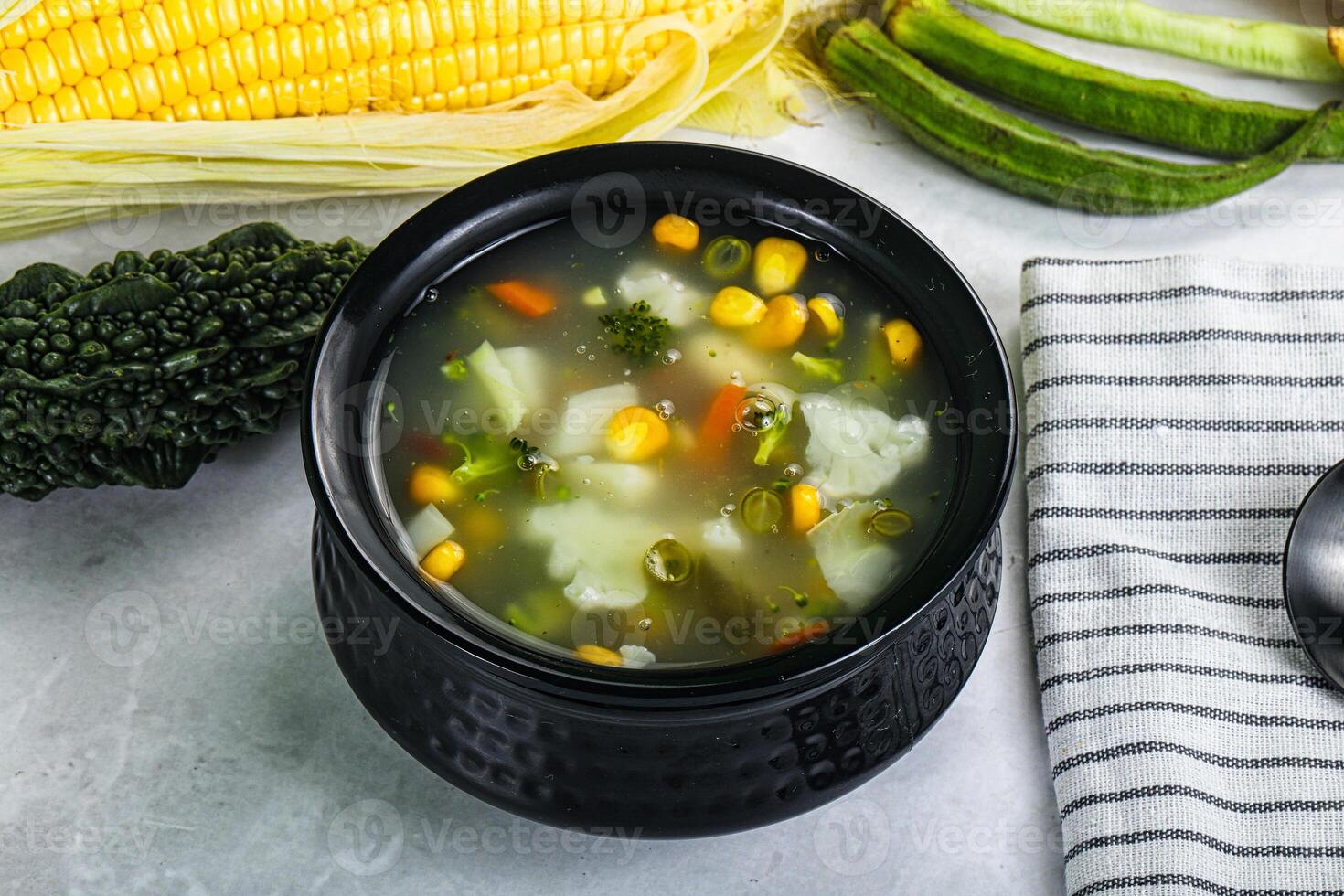 Soup with corn and broccoli photo