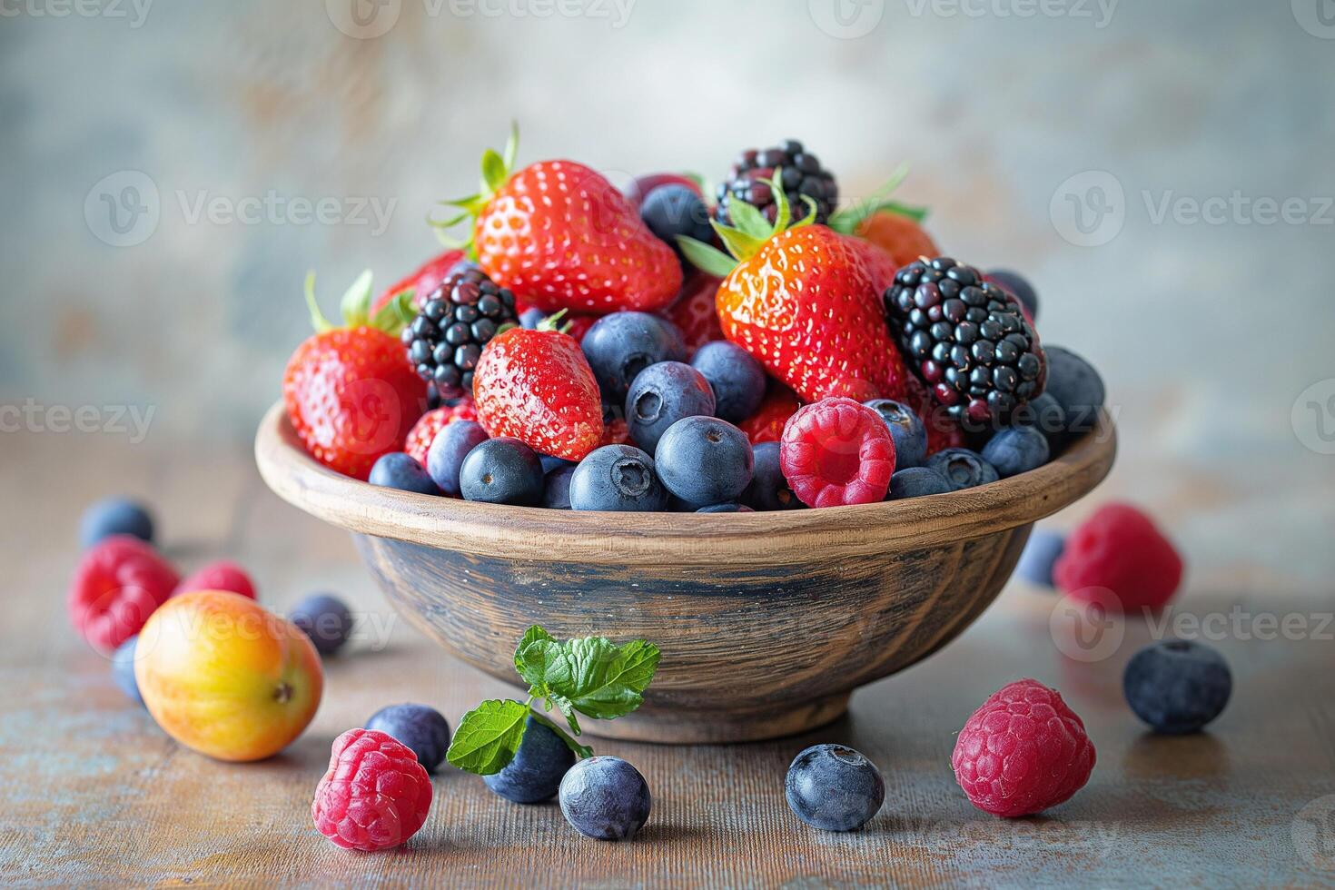 Rustic bowl filled with an assortment of juicy berries and fruits photo