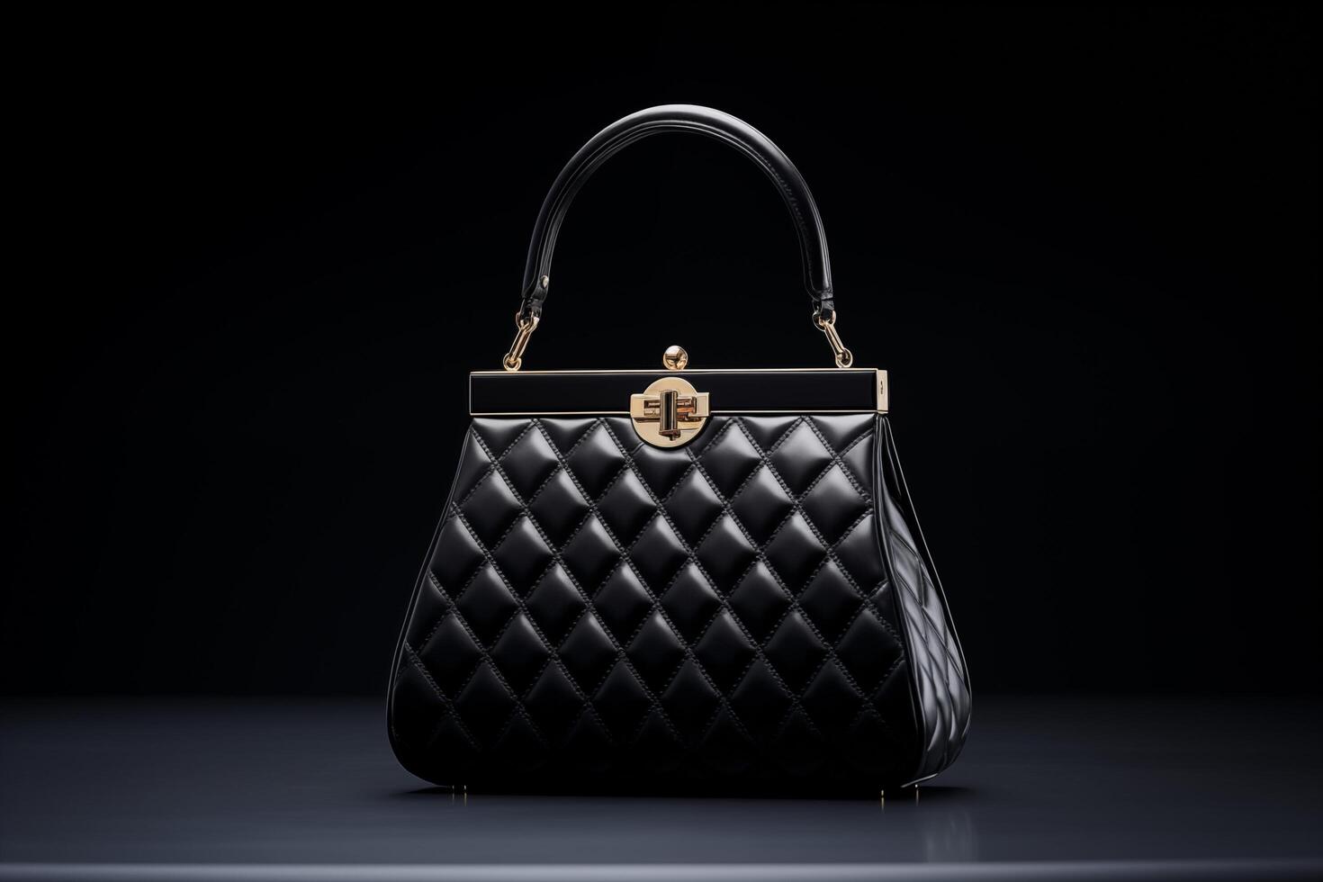A black quilted handbag with gold hardware sits on a dark surface photo