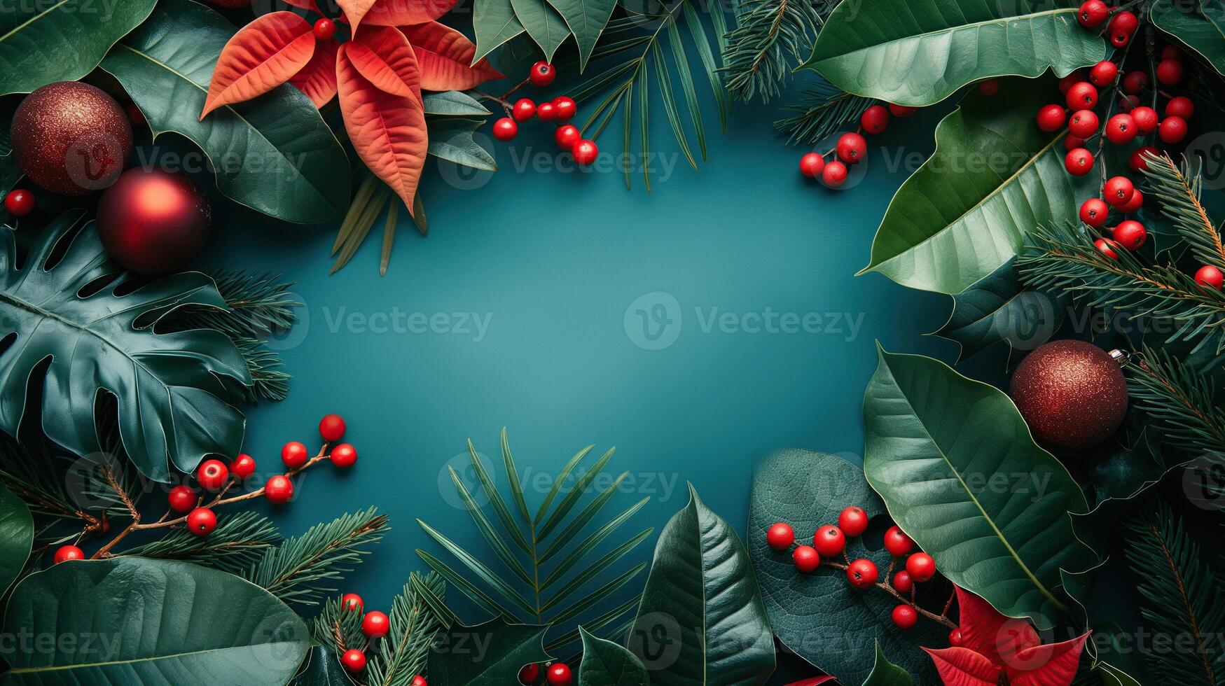 Christmas frame with red baubles, tropical leaves, and holly berries on a teal background photo