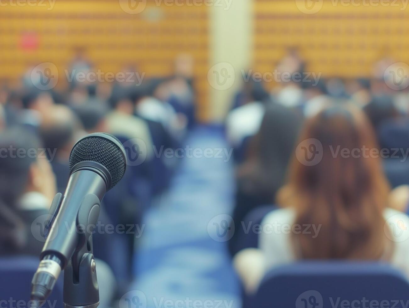 Lecture hall with attendees focused and business blurred background photo