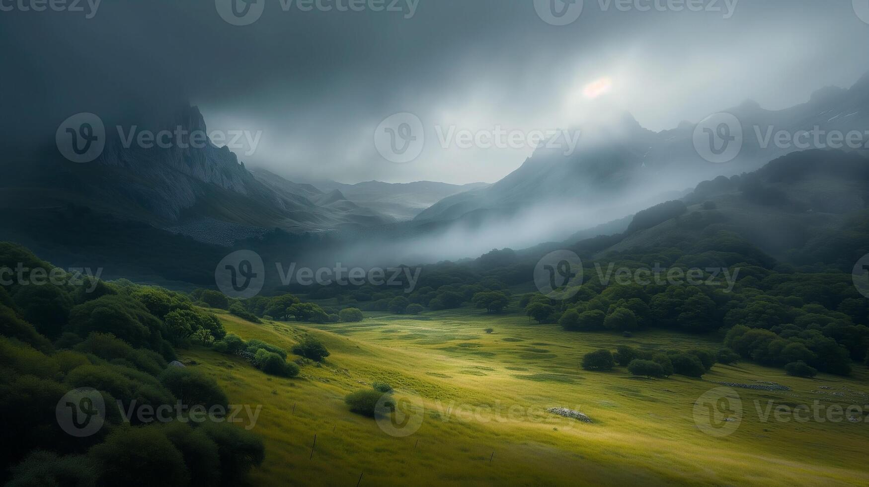 Mystical mountain landscape with fog rolling over green meadows photo